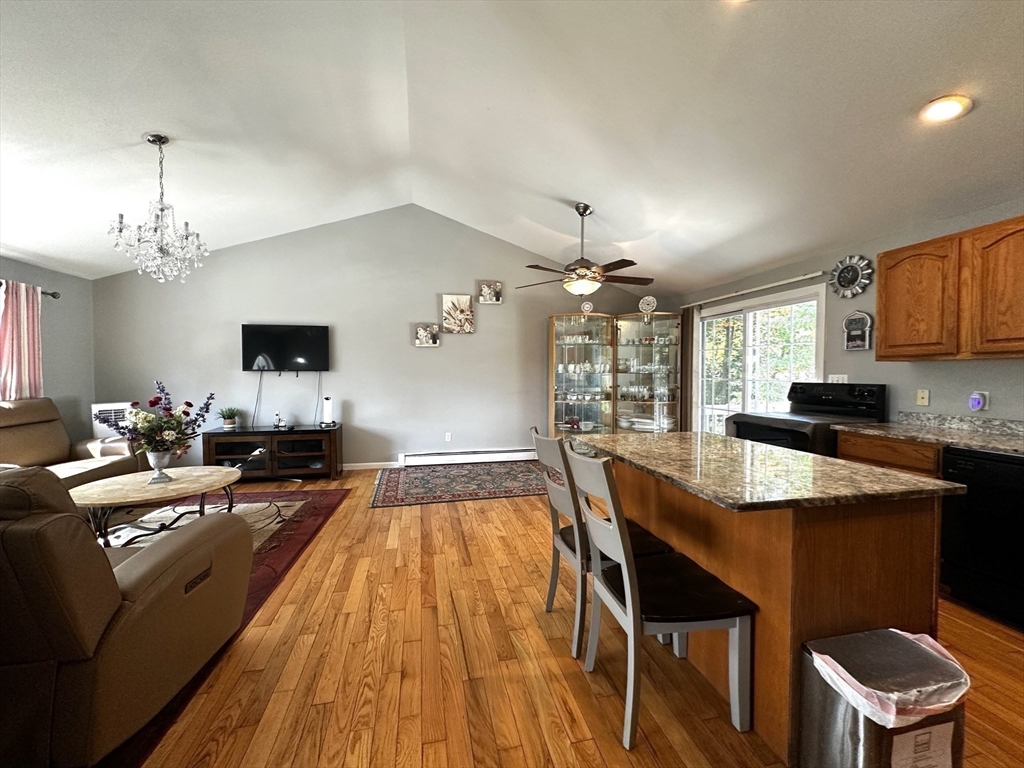 a large kitchen with a table and chairs in it