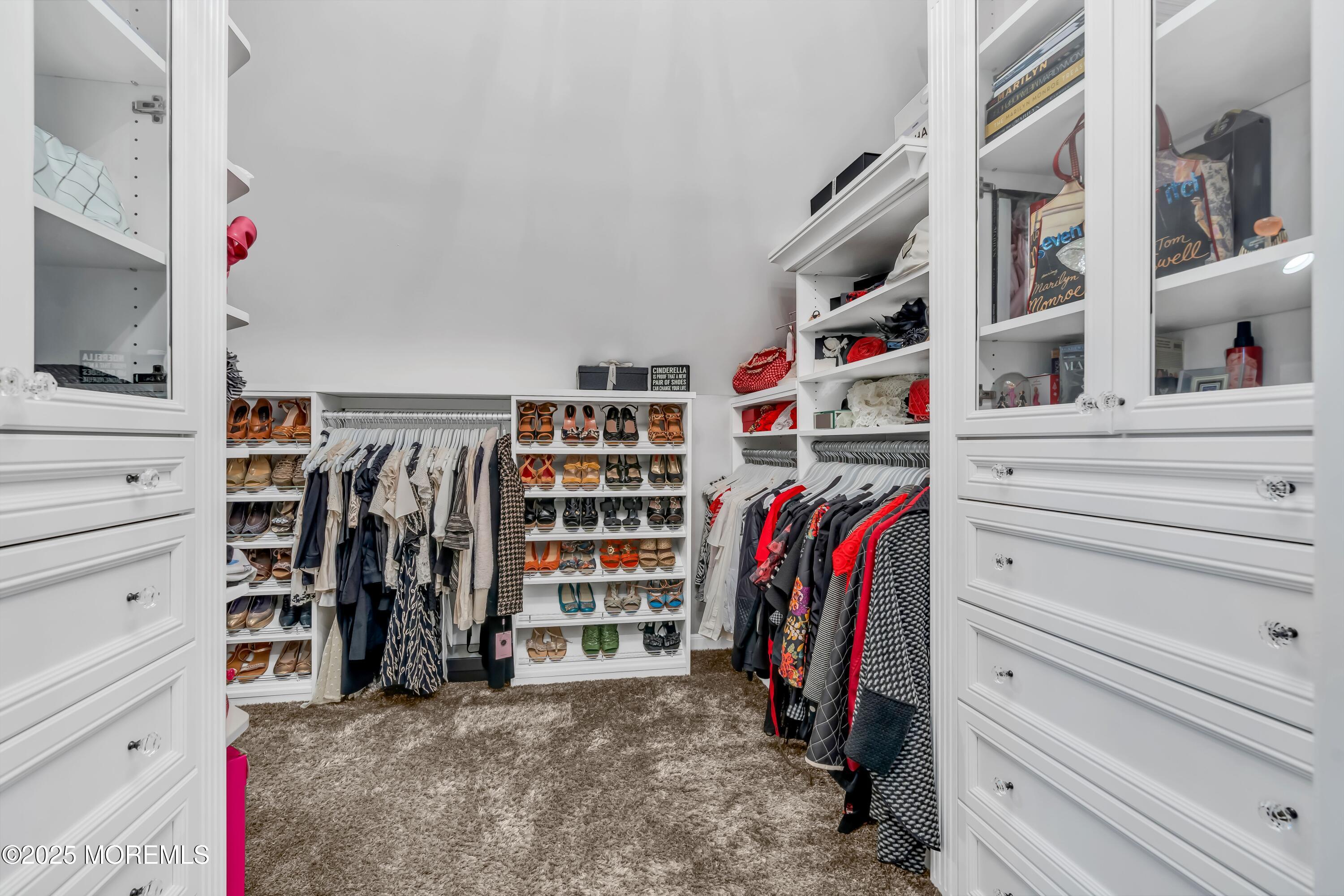 67 Picadilly Drive Jackson, NJ 08527 - Photo 27 of 49 a view of walk in closet with clothes and shoes