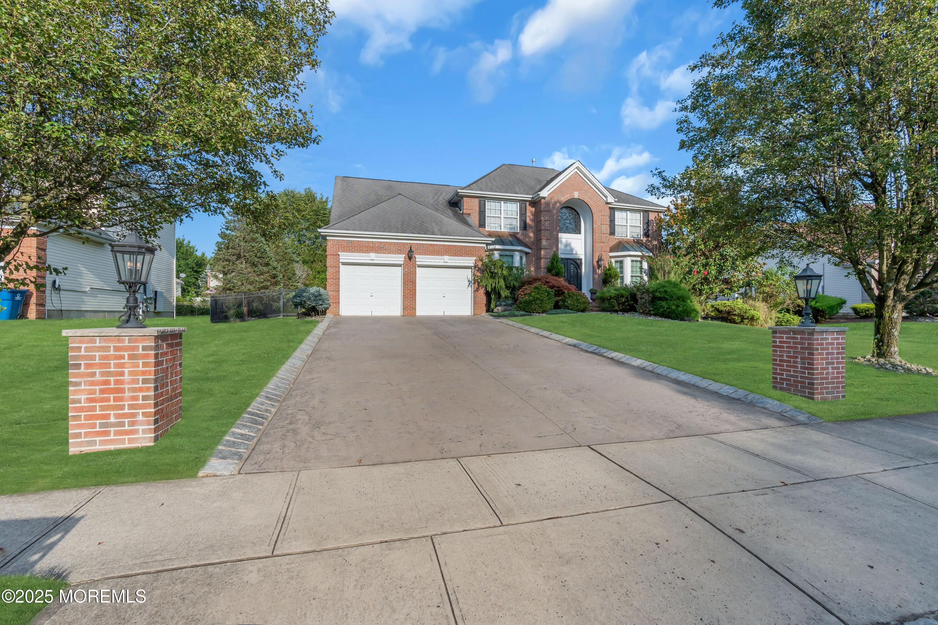 67 Picadilly Drive Jackson, NJ 08527 - Photo 3 of 49 a front view of a house with a yard and trees