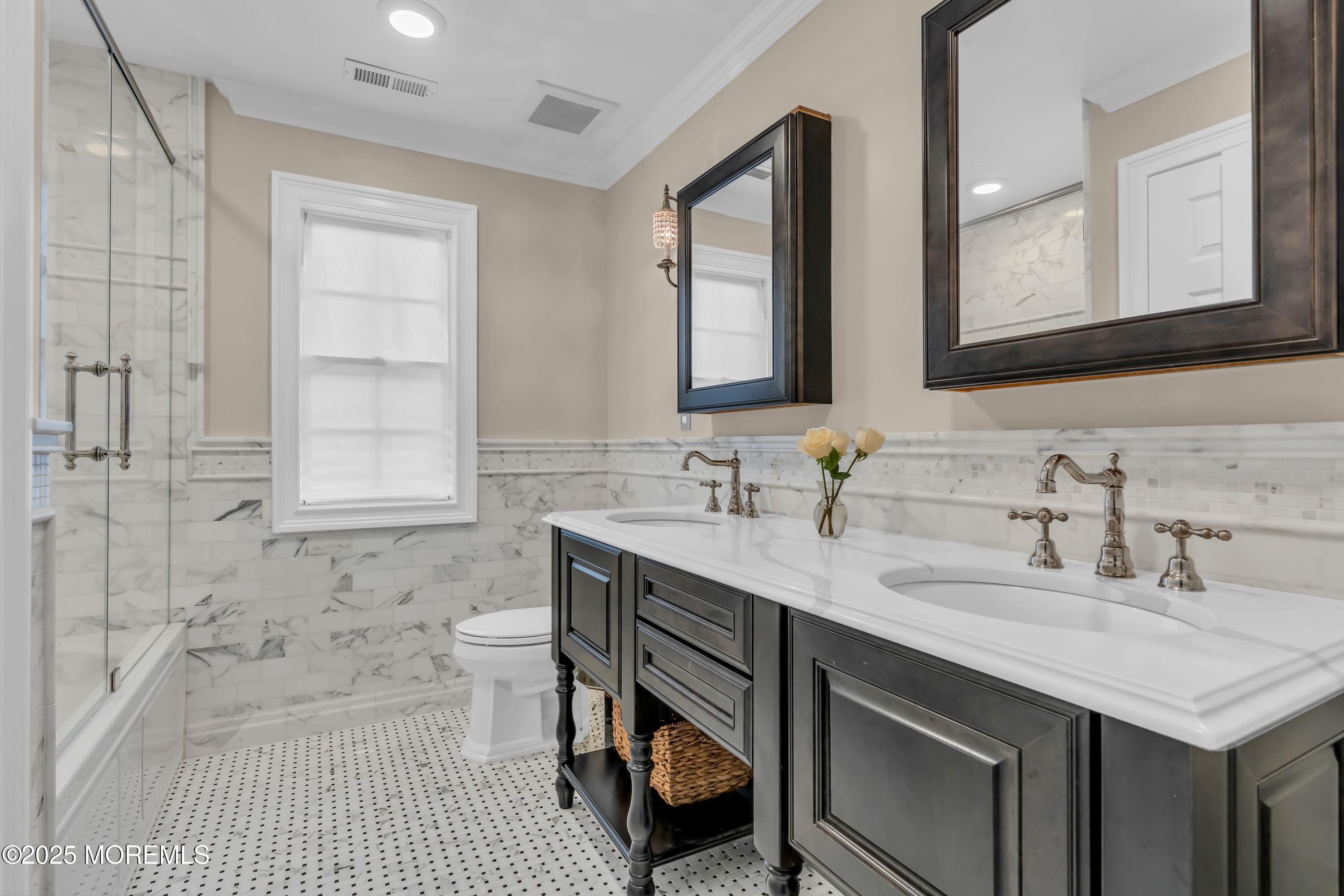 67 Picadilly Drive Jackson, NJ 08527 - Photo 33 of 49 a bathroom with a sink double vanity and a mirror