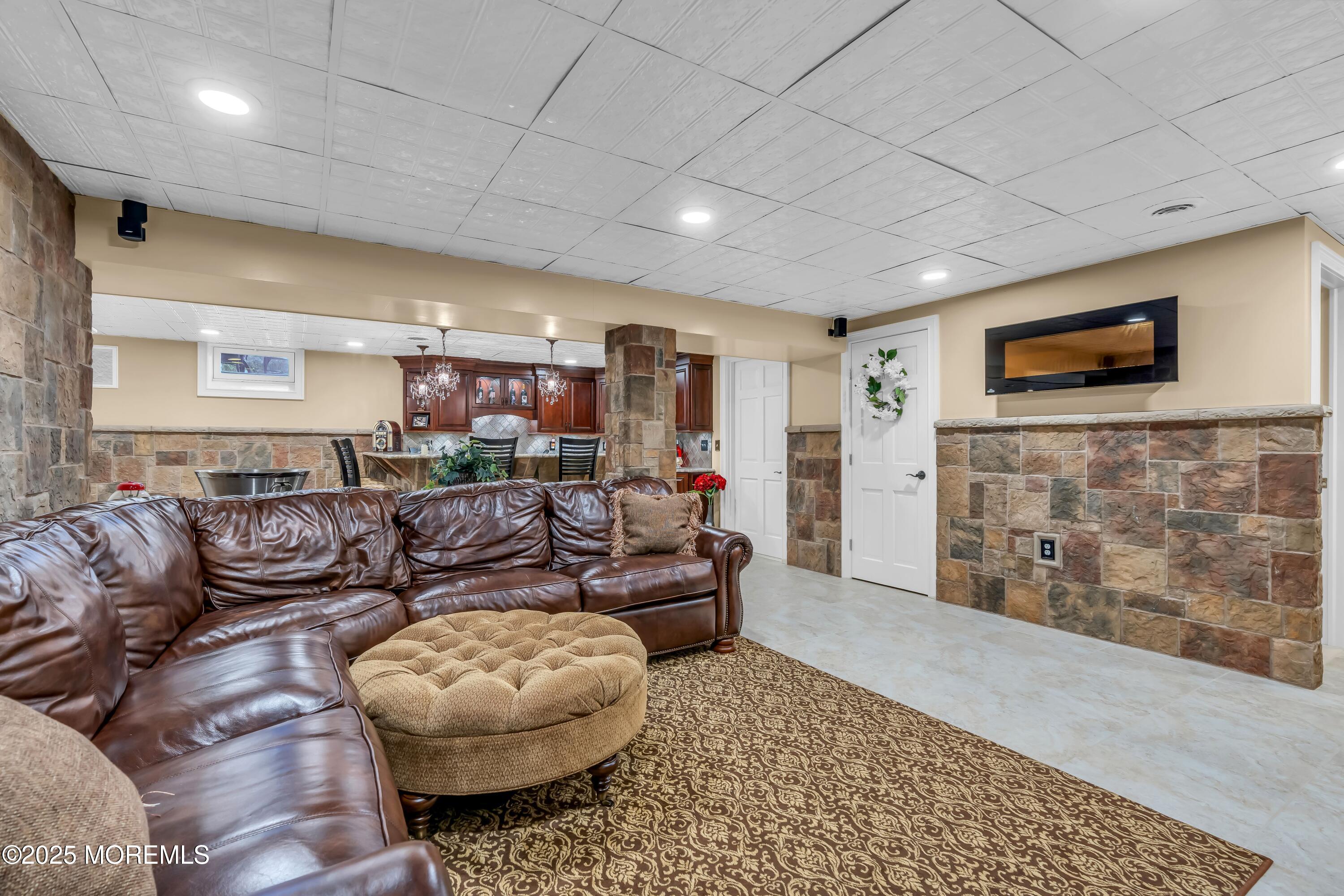 67 Picadilly Drive Jackson, NJ 08527 - Photo 35 of 49 a living room with furniture and a flat screen tv