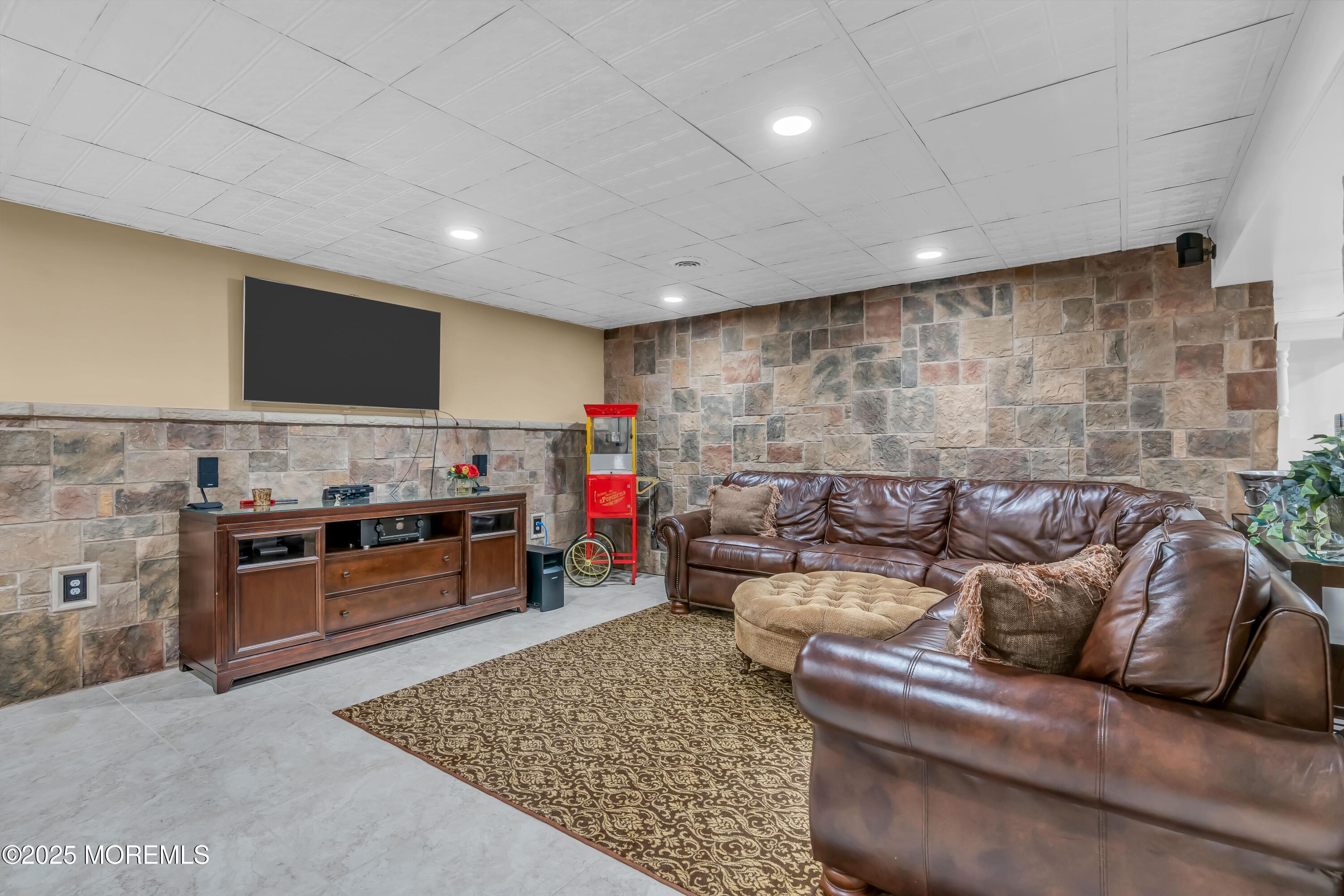 67 Picadilly Drive Jackson, NJ 08527 - Photo 36 of 49 a living room with furniture and a flat screen tv