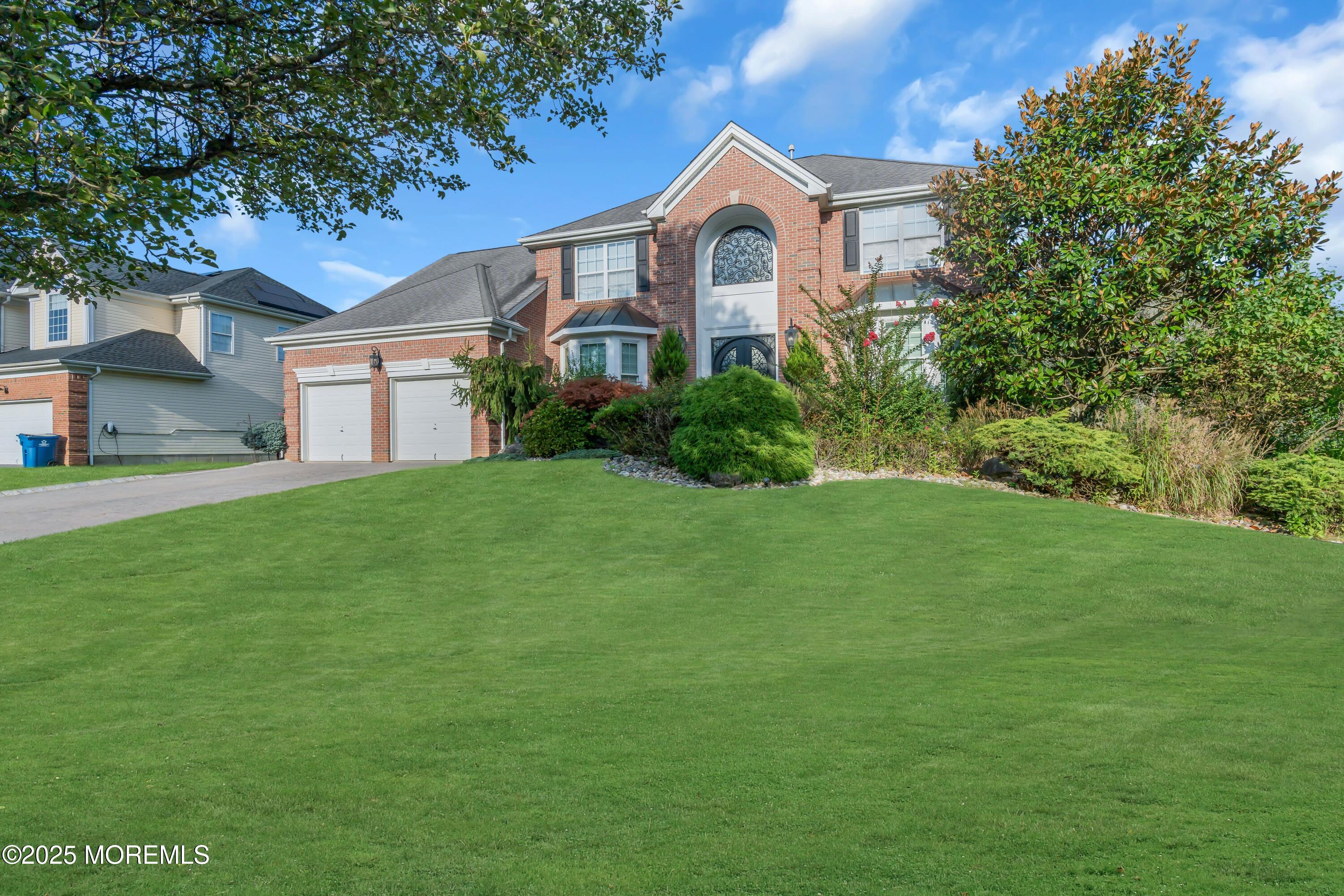 67 Picadilly Drive Jackson, NJ 08527 - Photo 4 of 49 a front view of a house with a garden