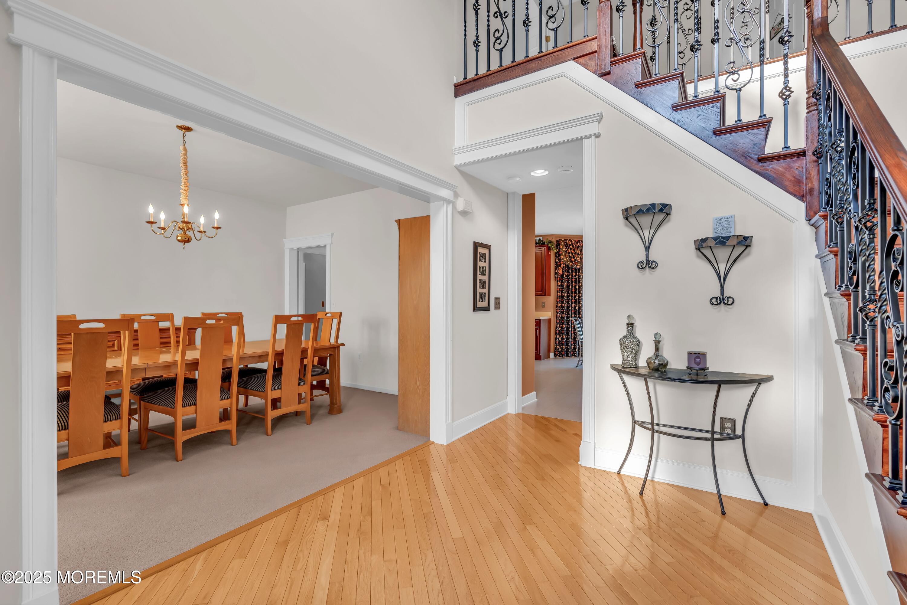 67 Picadilly Drive Jackson, NJ 08527 - Photo 8 of 49 a living room with furniture and a chandelier