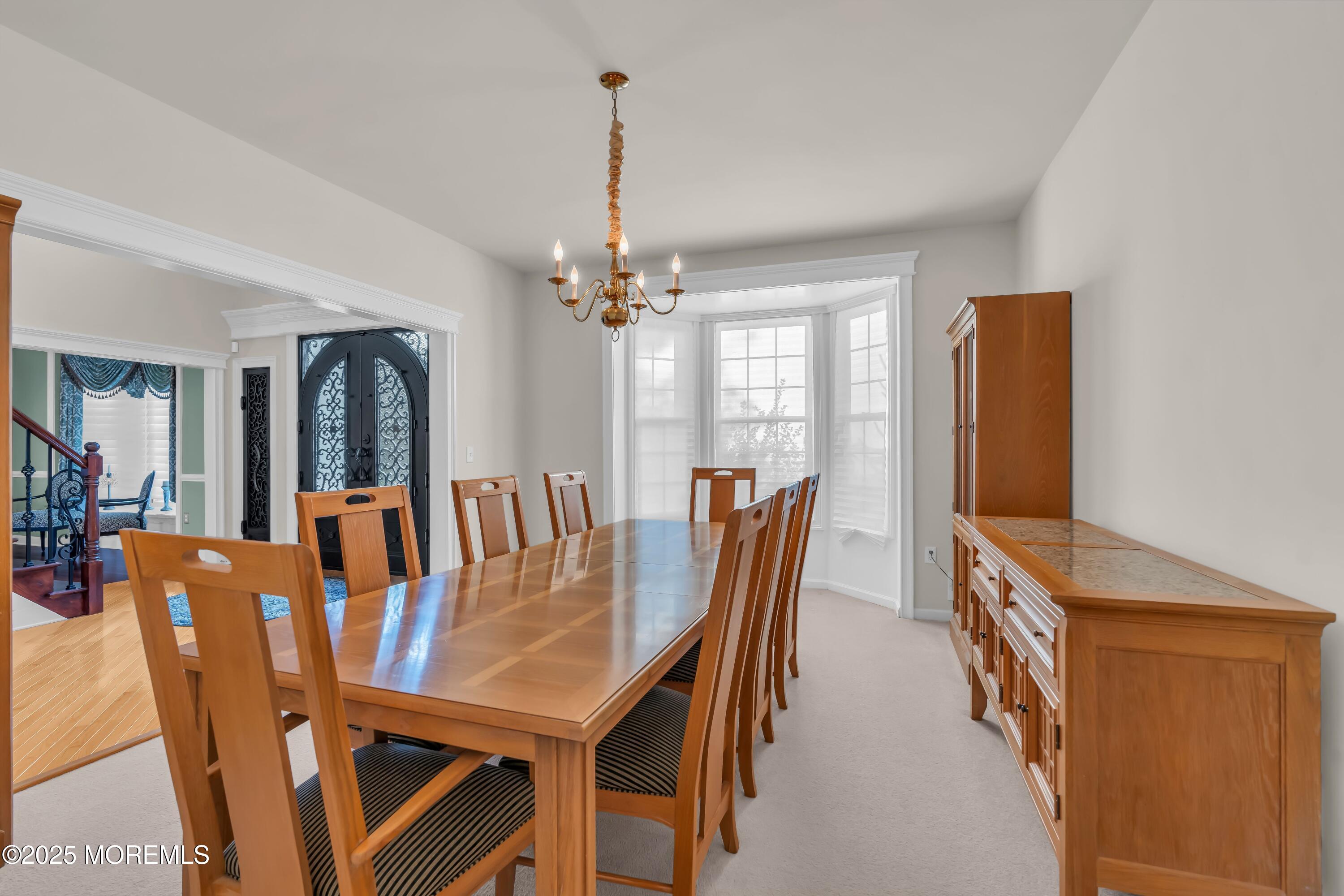 67 Picadilly Drive Jackson, NJ 08527 - Photo 9 of 49 a view of a dining room with furniture and chandelier