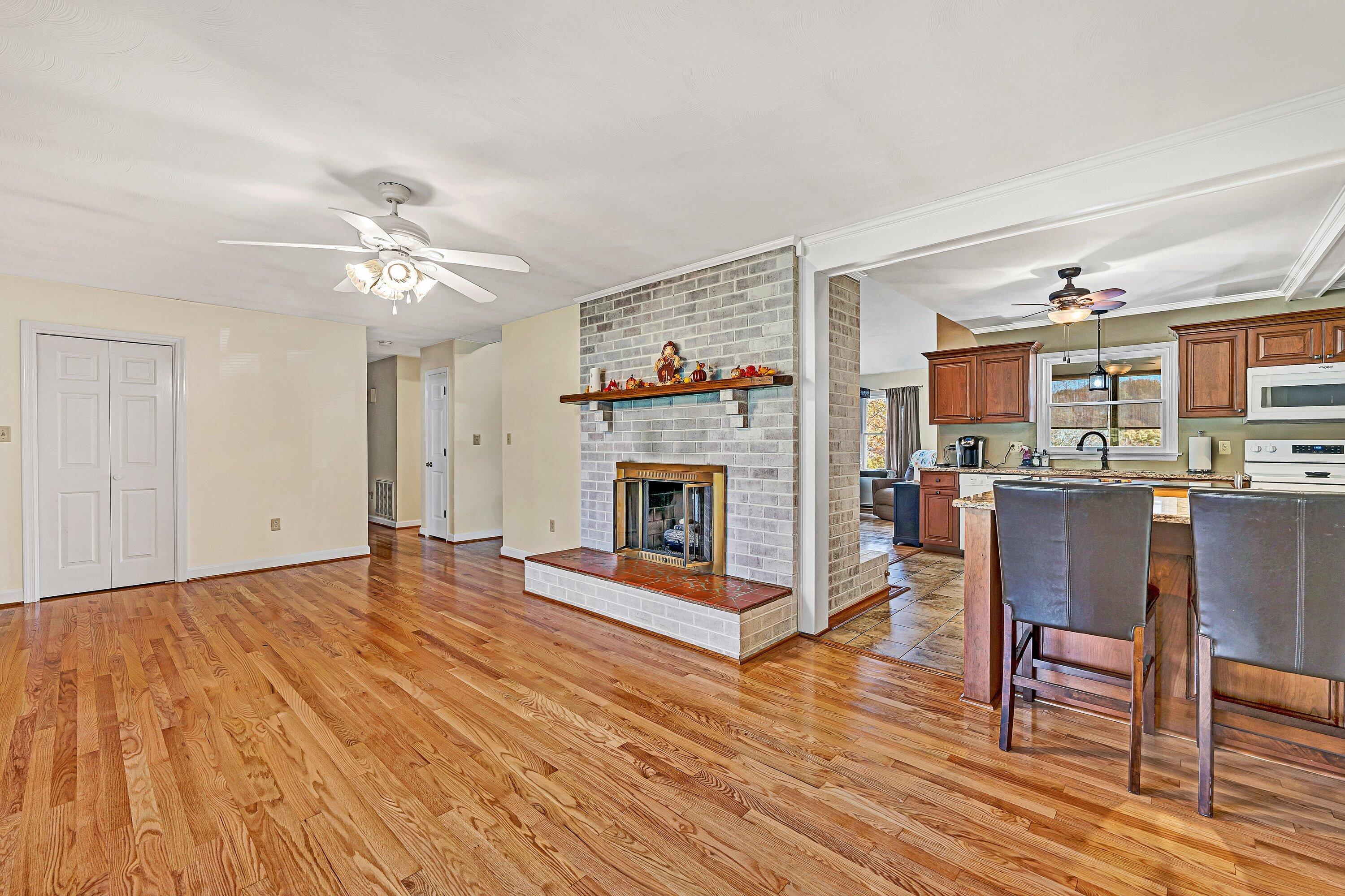 2228 Thomason Lane Goodview, VA 24095 - Photo 11 of 70 a living room with furniture and a fireplace