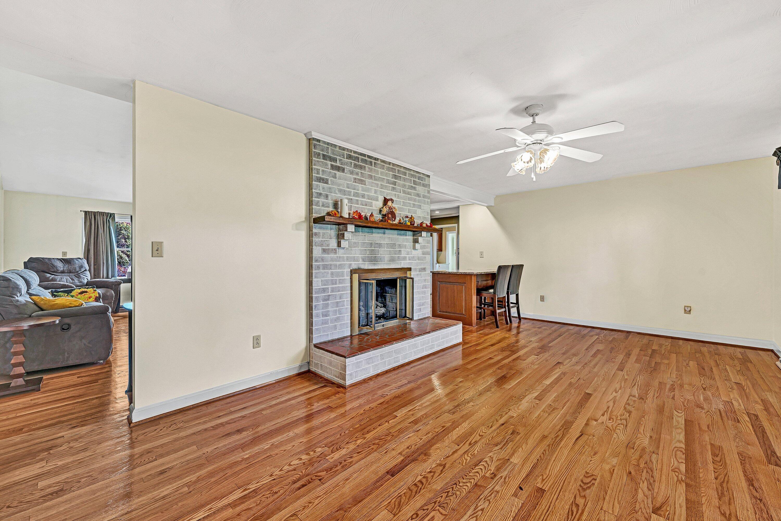 2228 Thomason Lane Goodview, VA 24095 - Photo 12 of 70 a living room with furniture and a fireplace