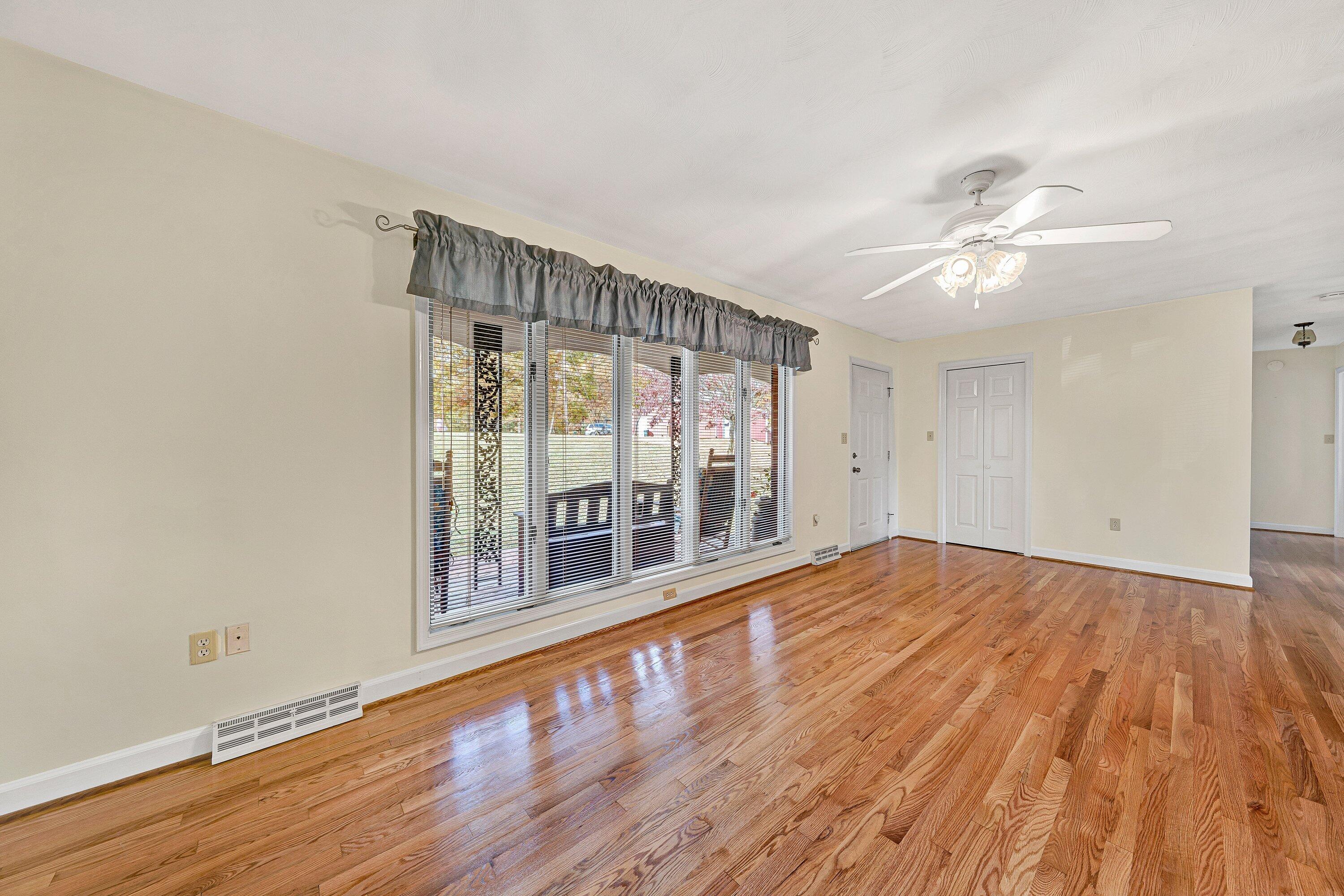 2228 Thomason Lane Goodview, VA 24095 - Photo 13 of 70 wooden floor in an empty room with a window