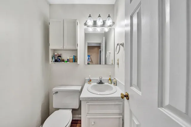 a view of a roof deck with table and chairs with wooden floor and fence