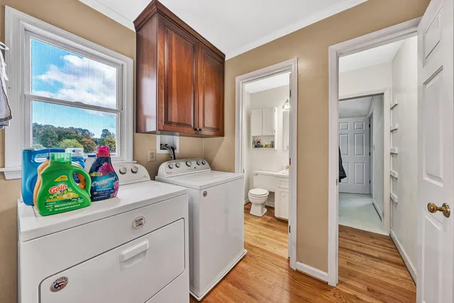 a balcony with furniture and a large window