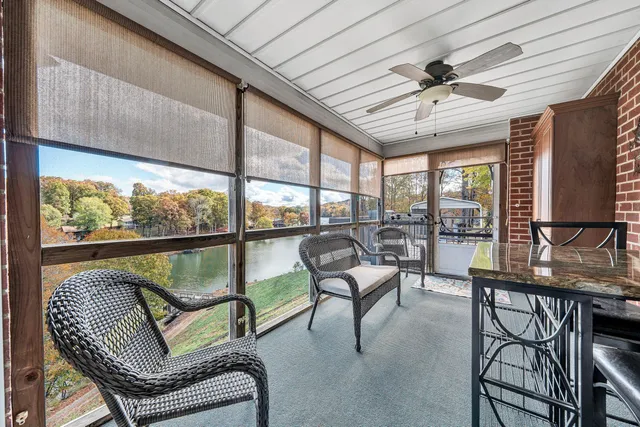 a bedroom with bed and a flat tv screen on dresser