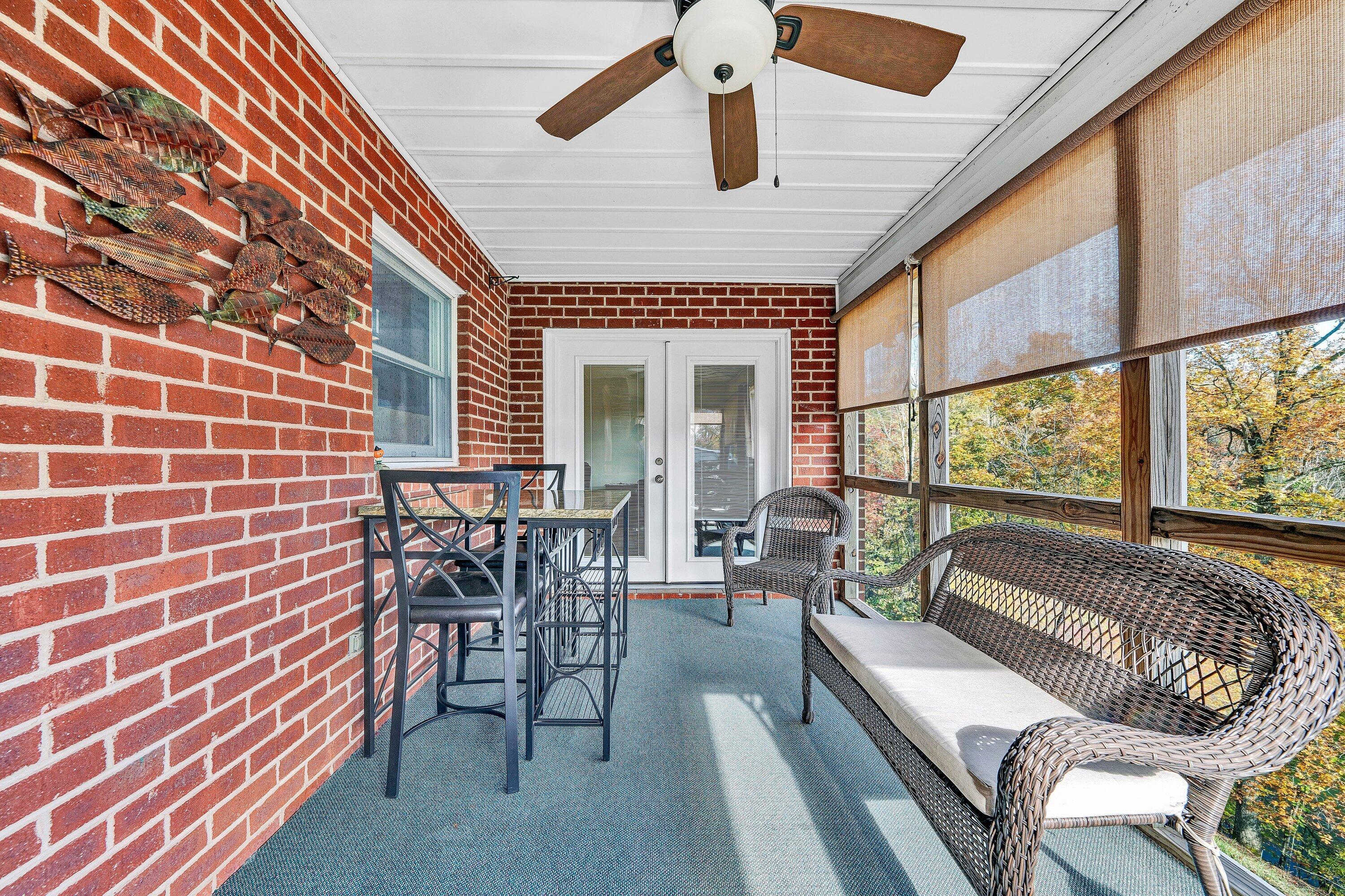 2228 Thomason Lane Goodview, VA 24095 - Photo 27 of 70 a balcony with furniture and a large window
