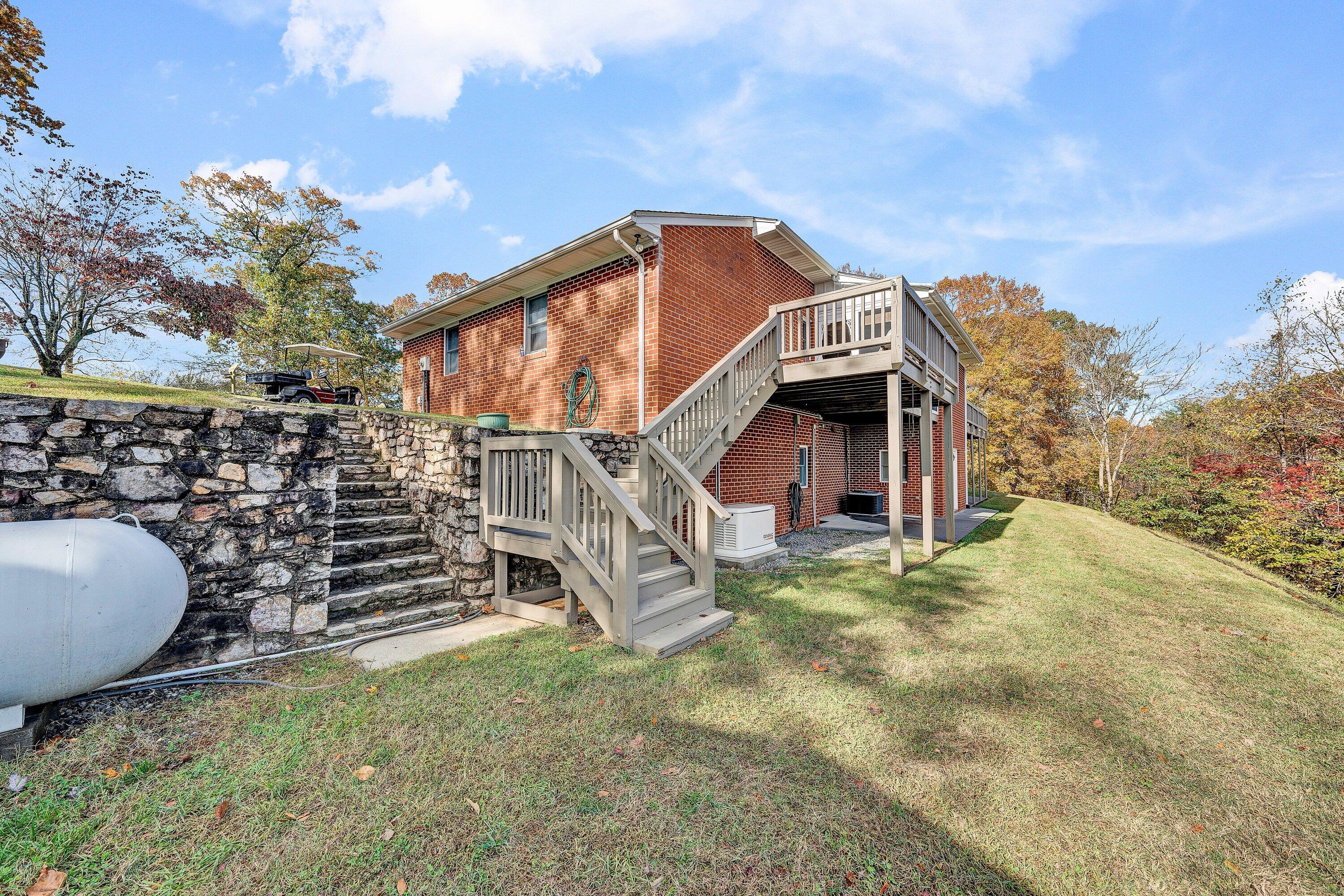 2228 Thomason Lane Goodview, VA 24095 - Photo 44 of 70 a view of a house with a yard