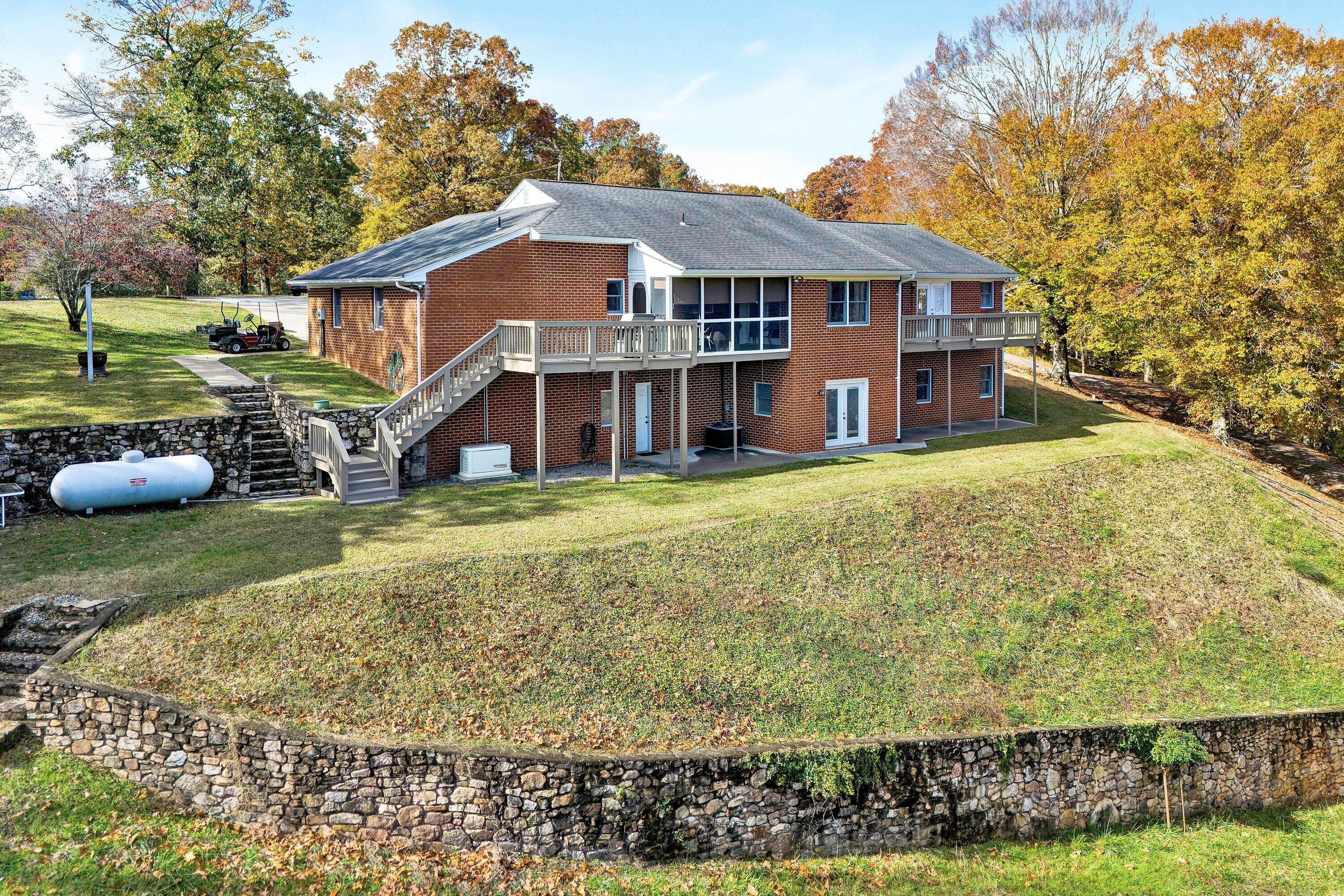2228 Thomason Lane Goodview, VA 24095 - Photo 45 of 70 a house view with a garden space