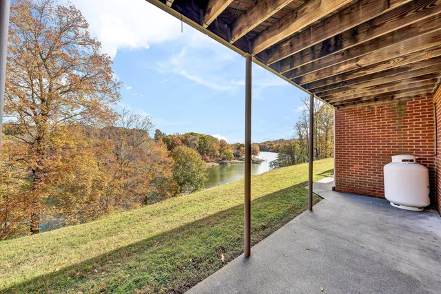 a view of a lake with a house in the background