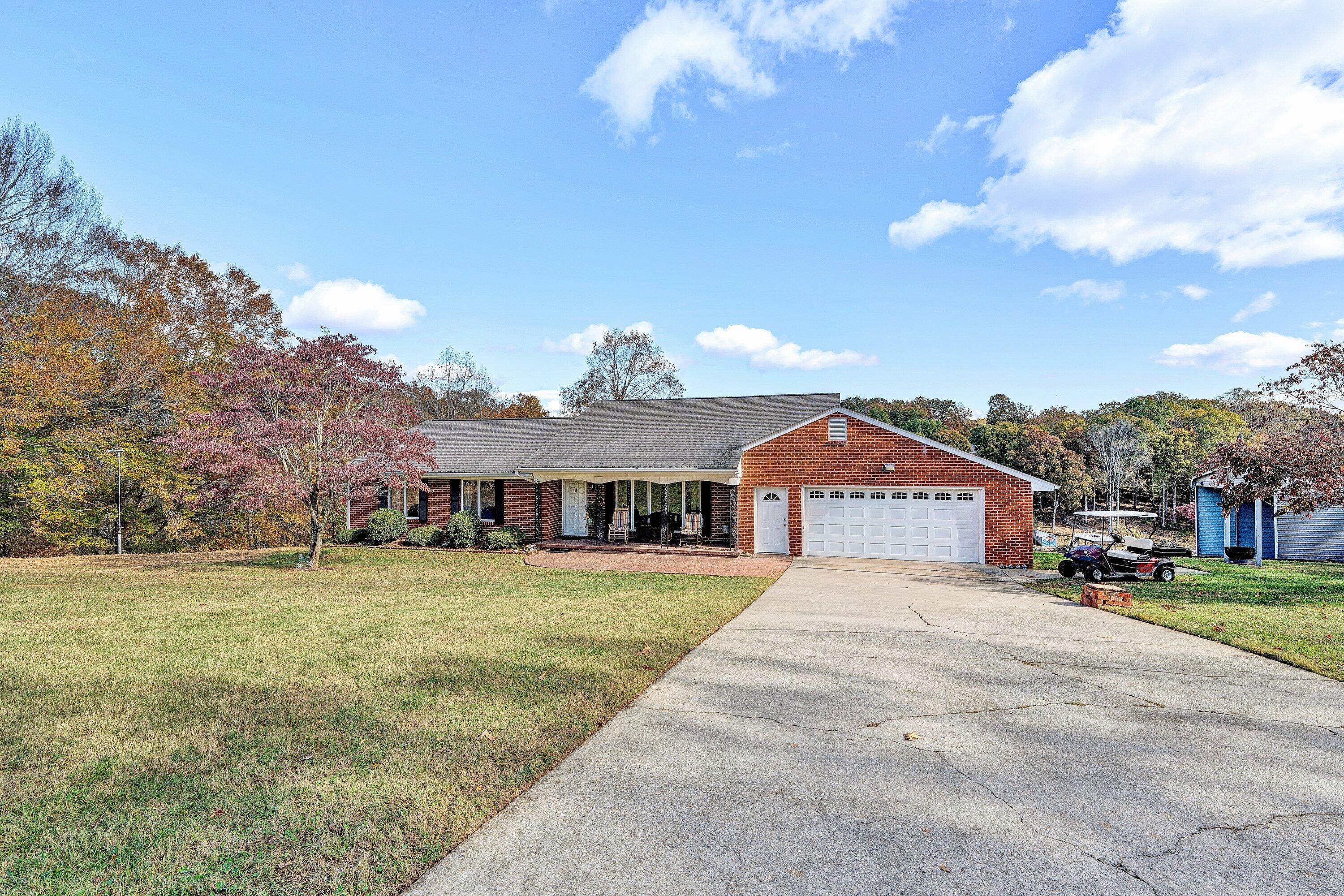 2228 Thomason Lane Goodview, VA 24095 - Photo 10 of 70 a front view of a house with a yard