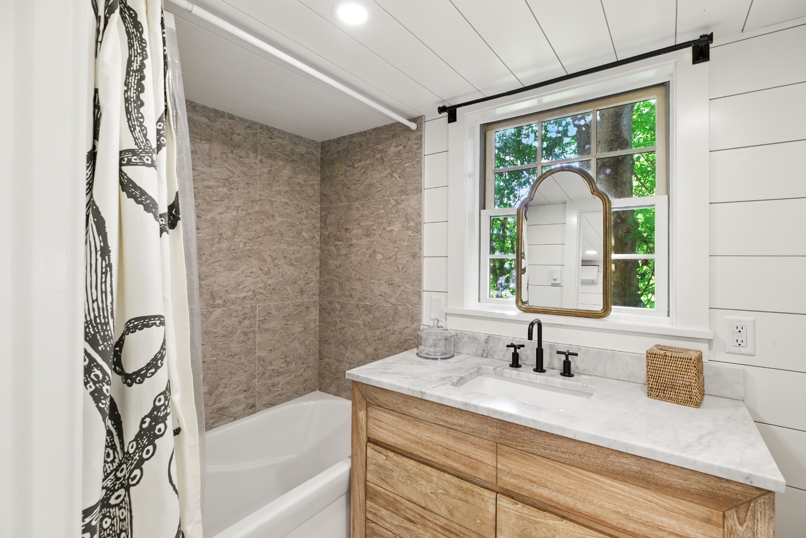 17 New Street Nantucket, MA 02554 - Photo 15 of 31 a bathroom with a granite countertop sink a mirror and a bathtub