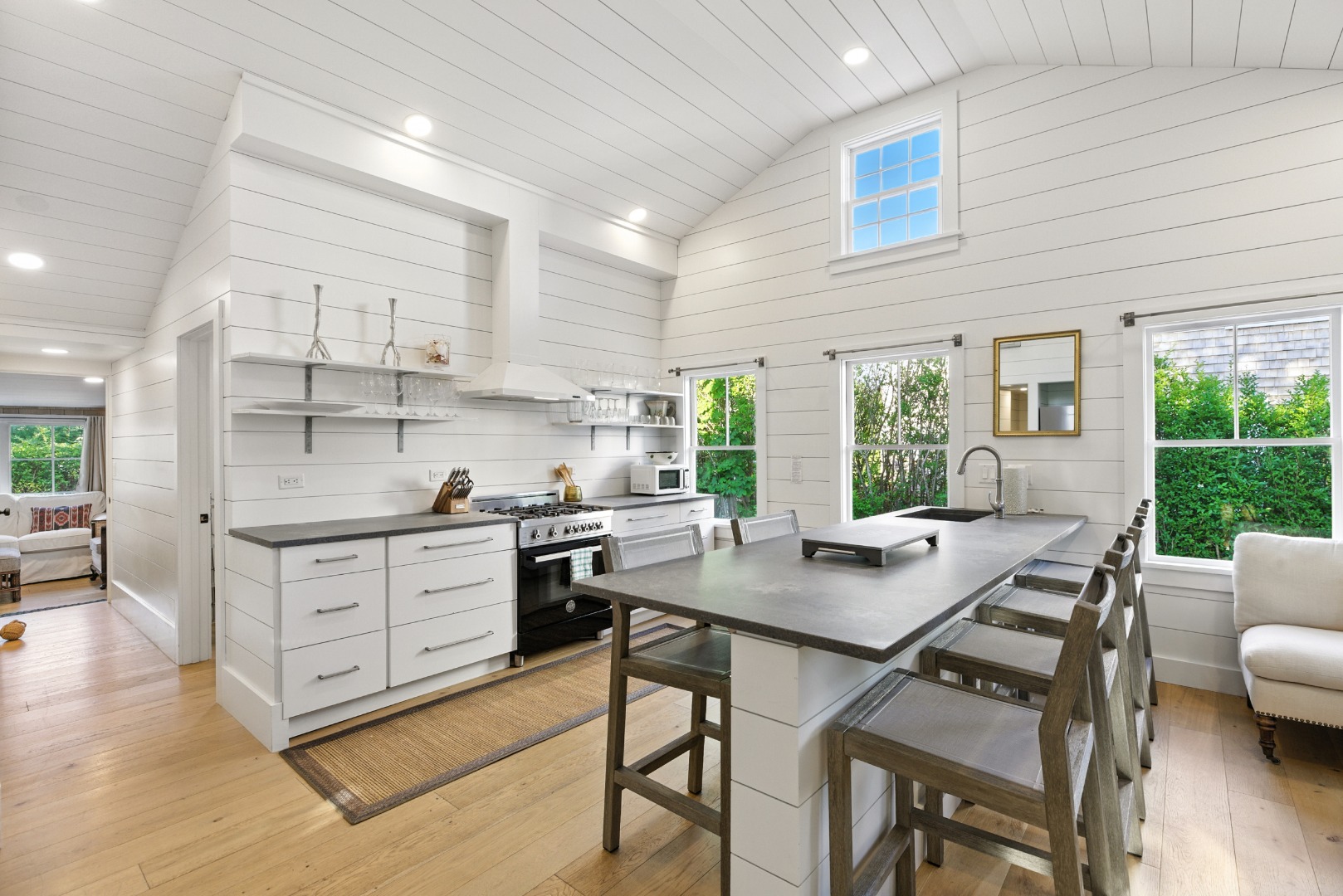 17 New Street Nantucket, MA 02554 - Photo 19 of 31 a kitchen with stainless steel appliances granite countertop a stove a sink a refrigerator and white cabinets