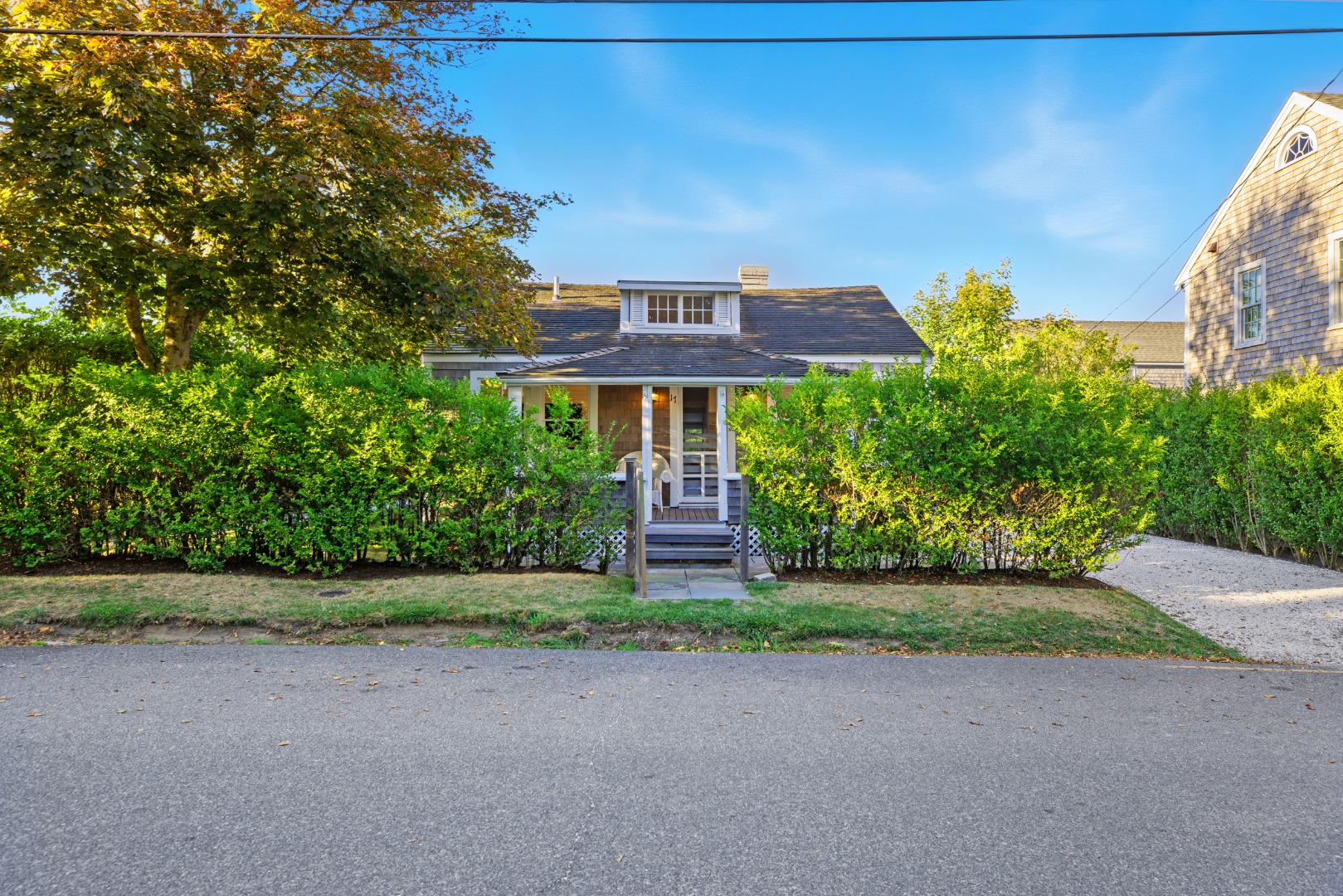 17 New Street Nantucket, MA 02554 - Photo 31 of 31 a front view of a house with a yard and garage