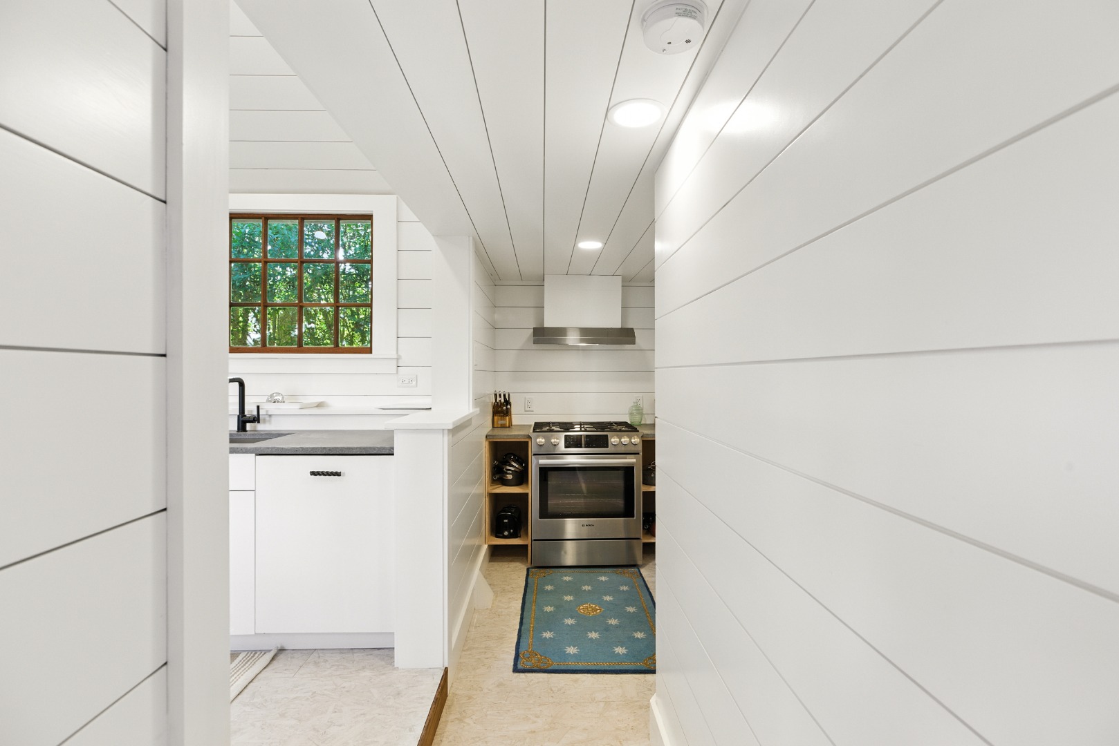 17 New Street Nantucket, MA 02554 - Photo 9 of 31 a kitchen with a refrigerator and a stove