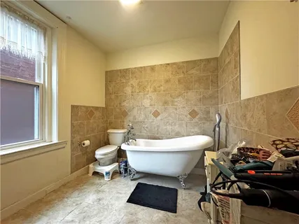 a bathroom with a toilet a sink and a shower