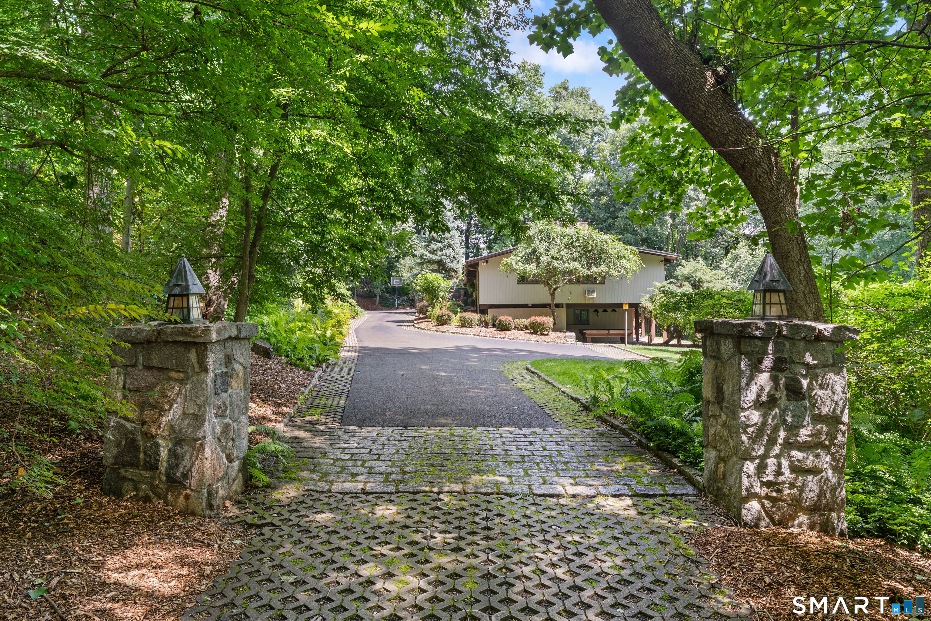132 Signal Hill Road Wilton, CT 06897 - Photo 6 of 32 Entering through lighted stone pillars adds an elegance to the property.