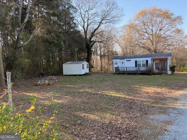 2693 Dempsey Brown Road Dewy Rose, GA 30634 - Photo 16 of 28 a view of a house with a yard and tree s