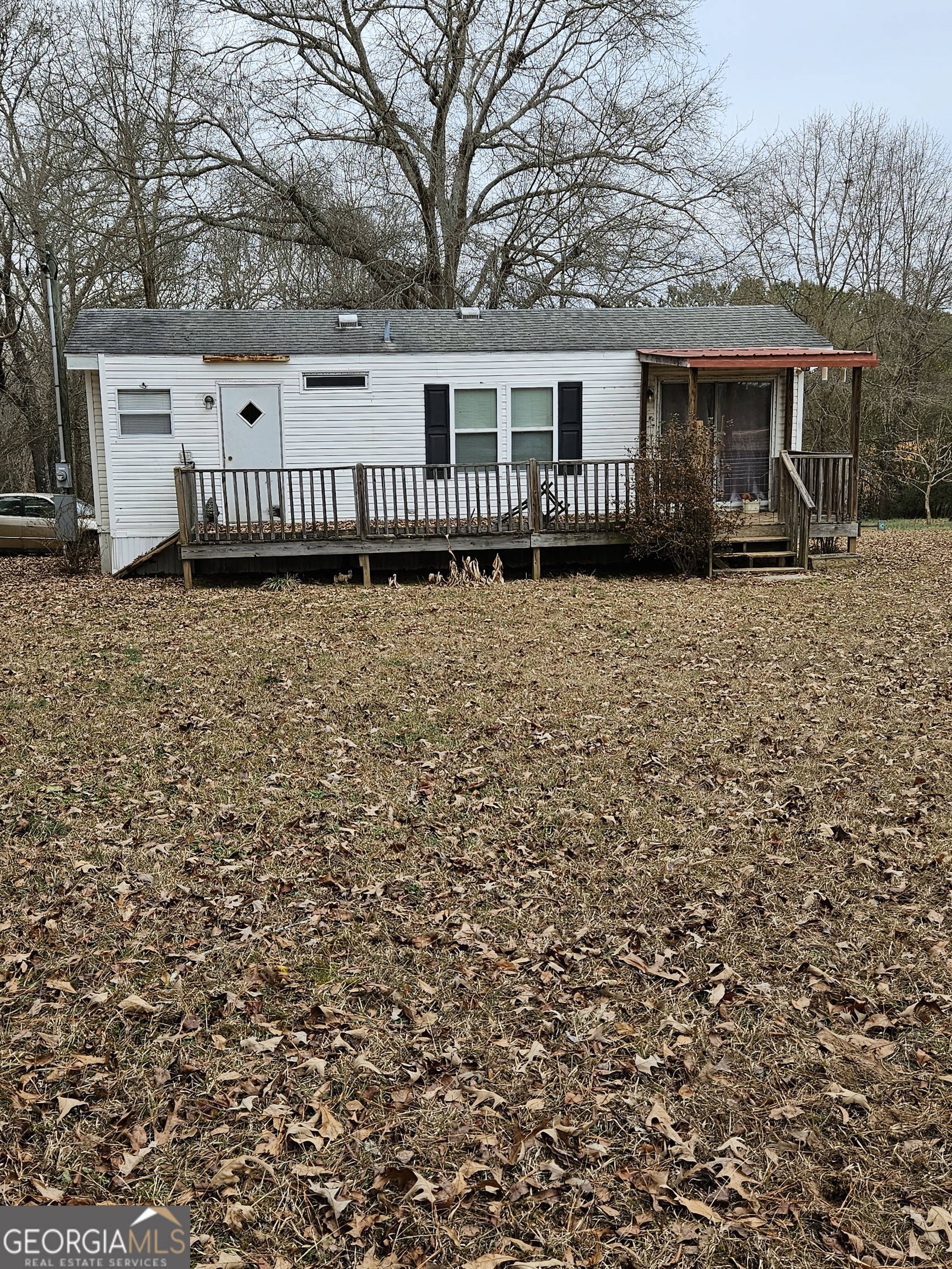 2693 Dempsey Brown Road Dewy Rose, GA 30634 - Photo 4 of 28 a front view of a house with a garden