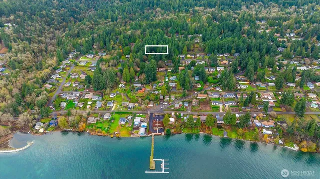 a backyard of a house with lots of green space and trees