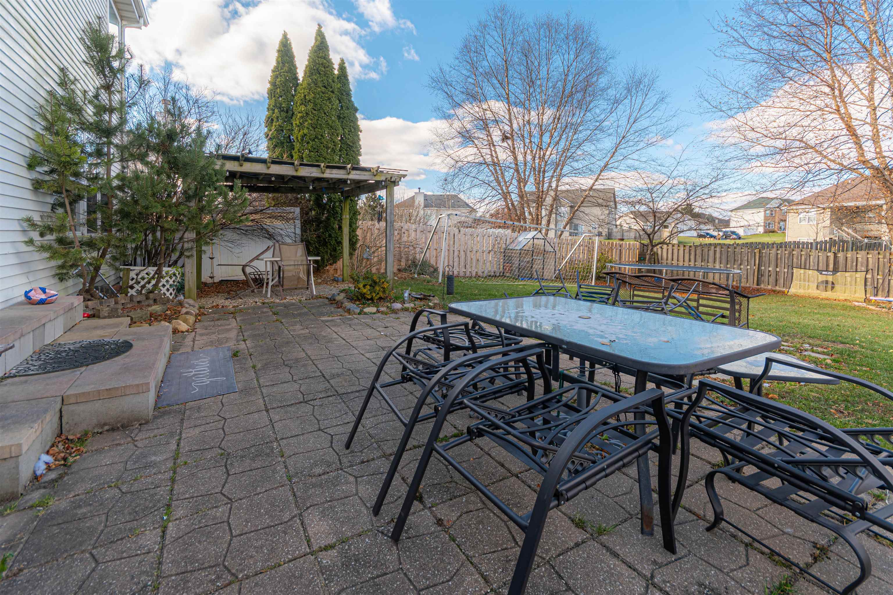 738 Trent Lane Loves Park, IL 61111 - Photo 11 of 37 a view of a chairs and table in backyard