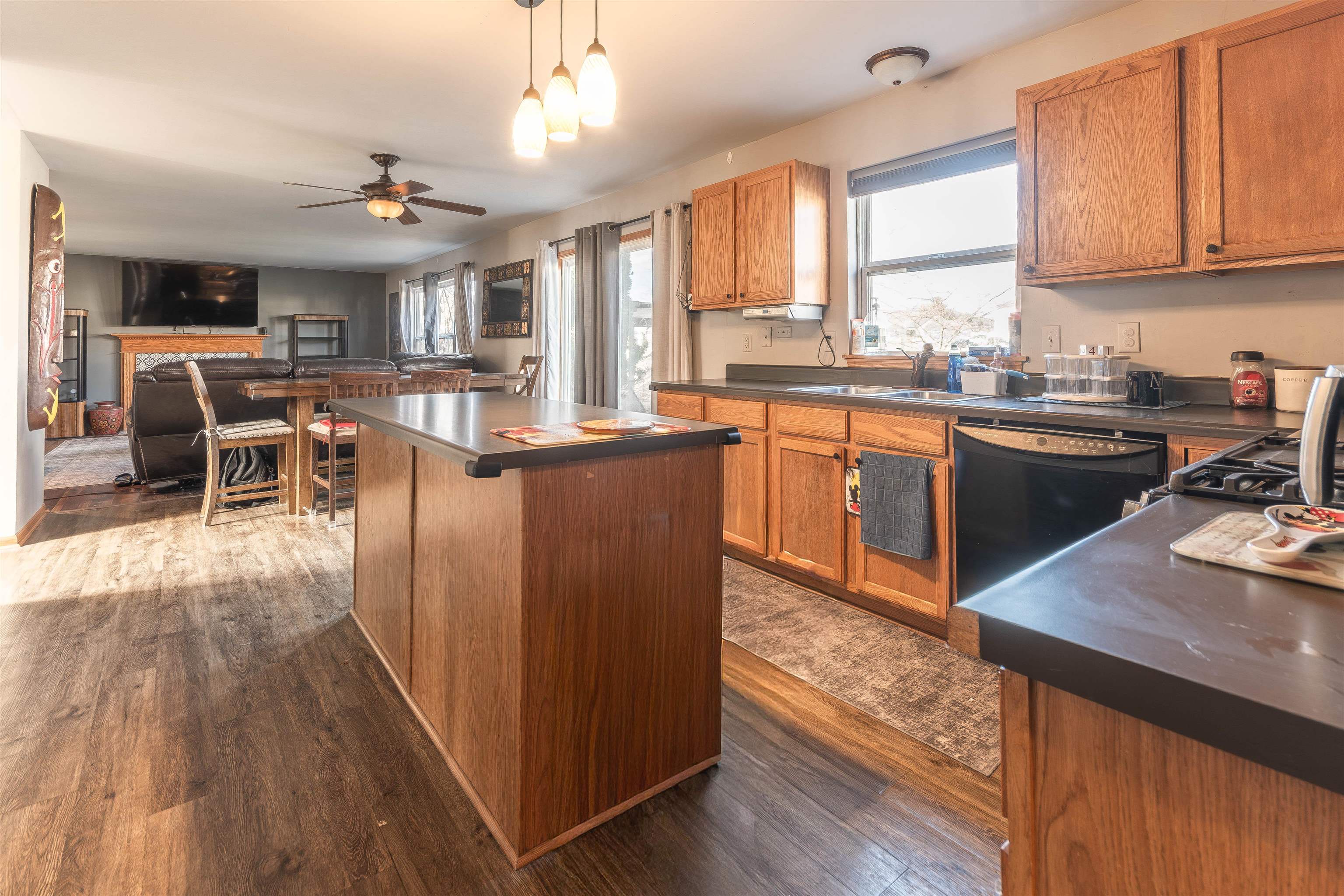 738 Trent Lane Loves Park, IL 61111 - Photo 16 of 37 a kitchen with stainless steel appliances granite countertop sink stove top oven and cabinets