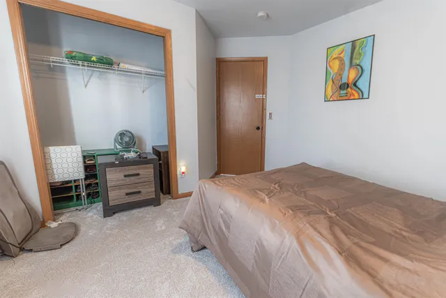 a bedroom with a bed and a cabinets