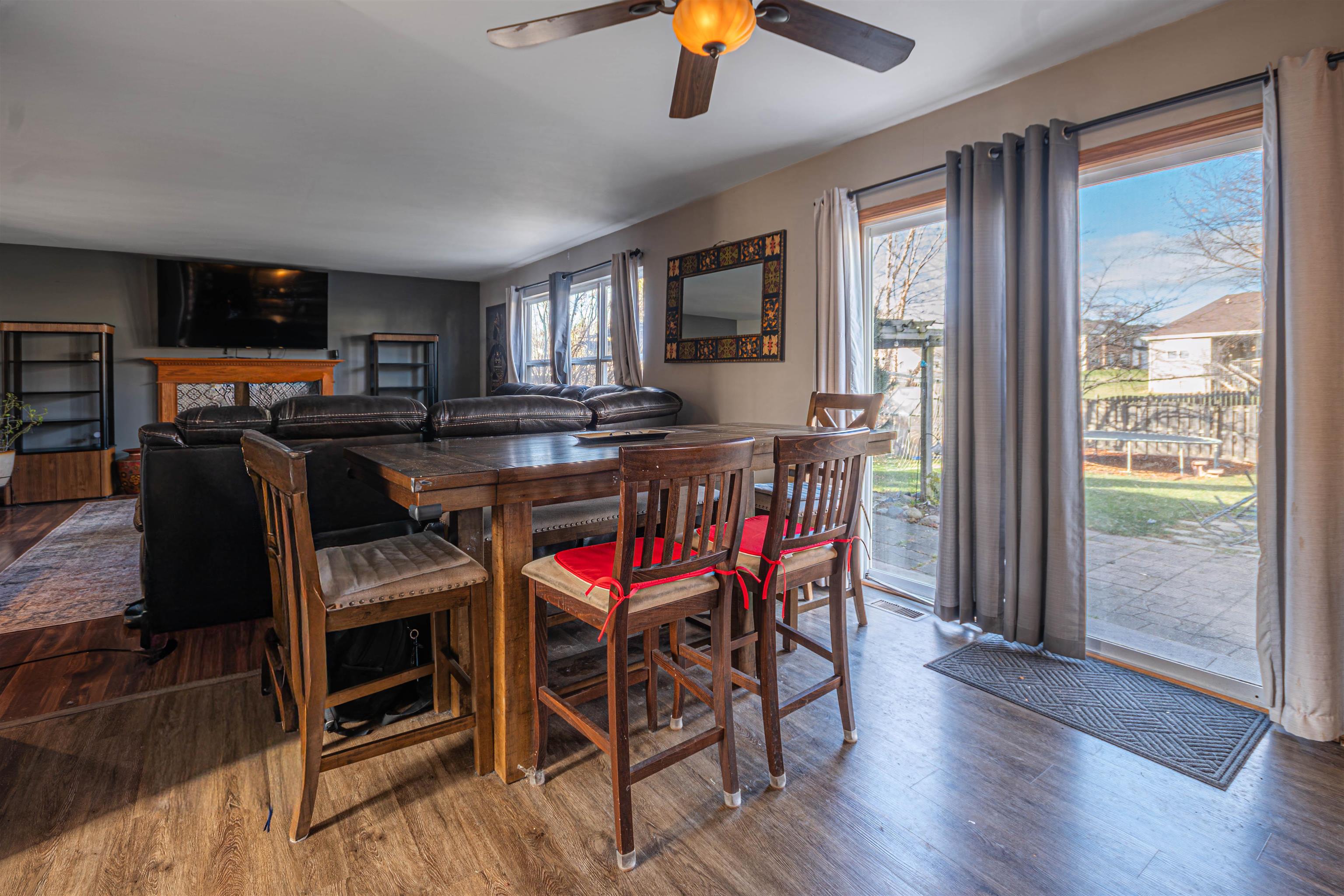 738 Trent Lane Loves Park, IL 61111 - Photo 3 of 37 a dining room with furniture window and wooden floor