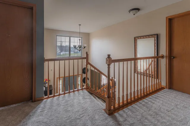 a view of a hallway with windows