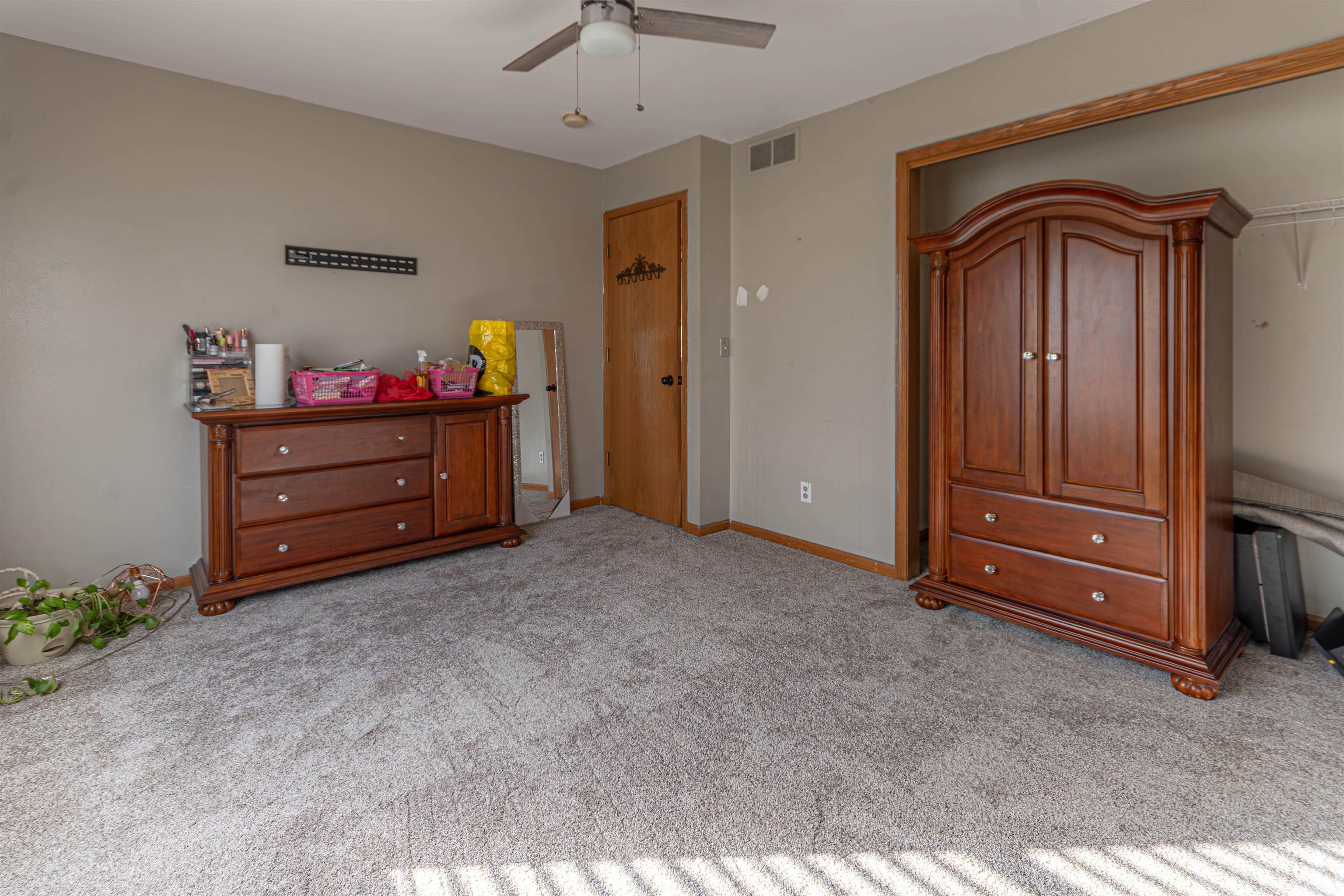 738 Trent Lane Loves Park, IL 61111 - Photo 32 of 37 a room with furniture and a dresser