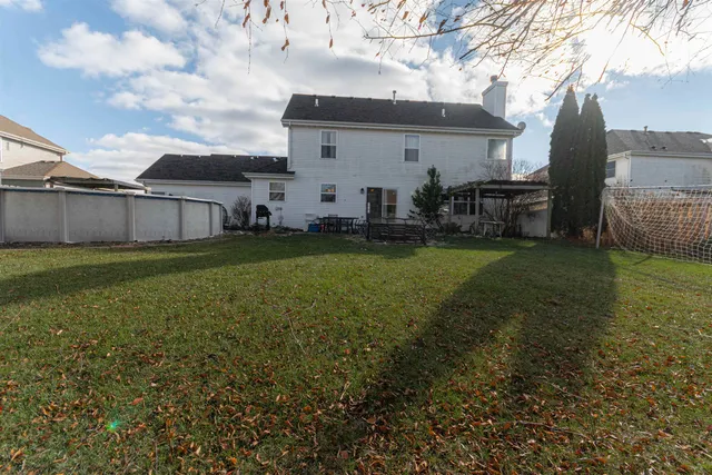 a view of a backyard with plants and a patio