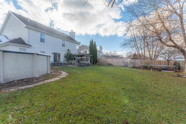 a view of a back yard of the house