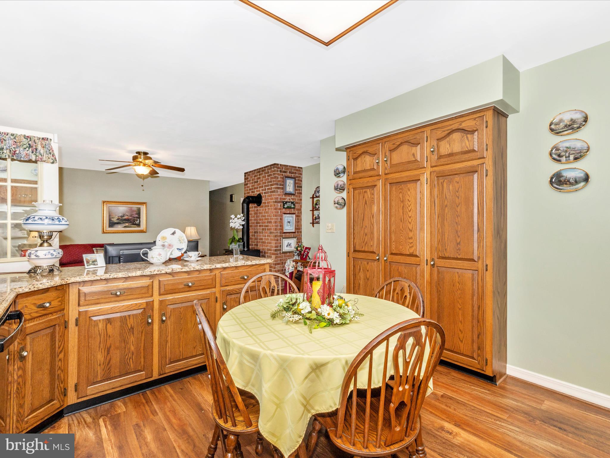 12720 Spickler Road Clear Spring, MD 21722 - Photo 12 of 57 a kitchen with stainless steel appliances granite countertop a dining table and chairs