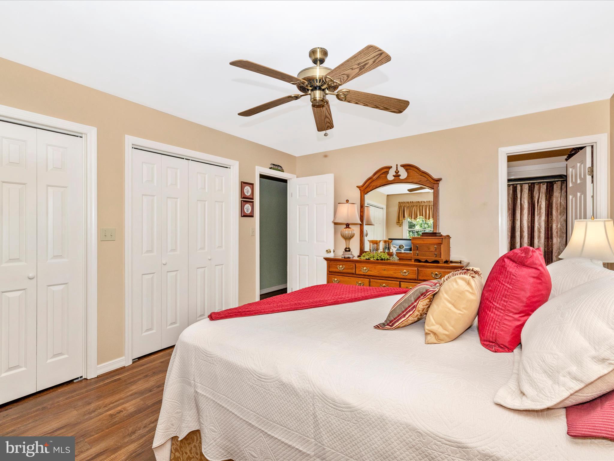 12720 Spickler Road Clear Spring, MD 21722 - Photo 24 of 57 a bedroom with a bed and a chandelier