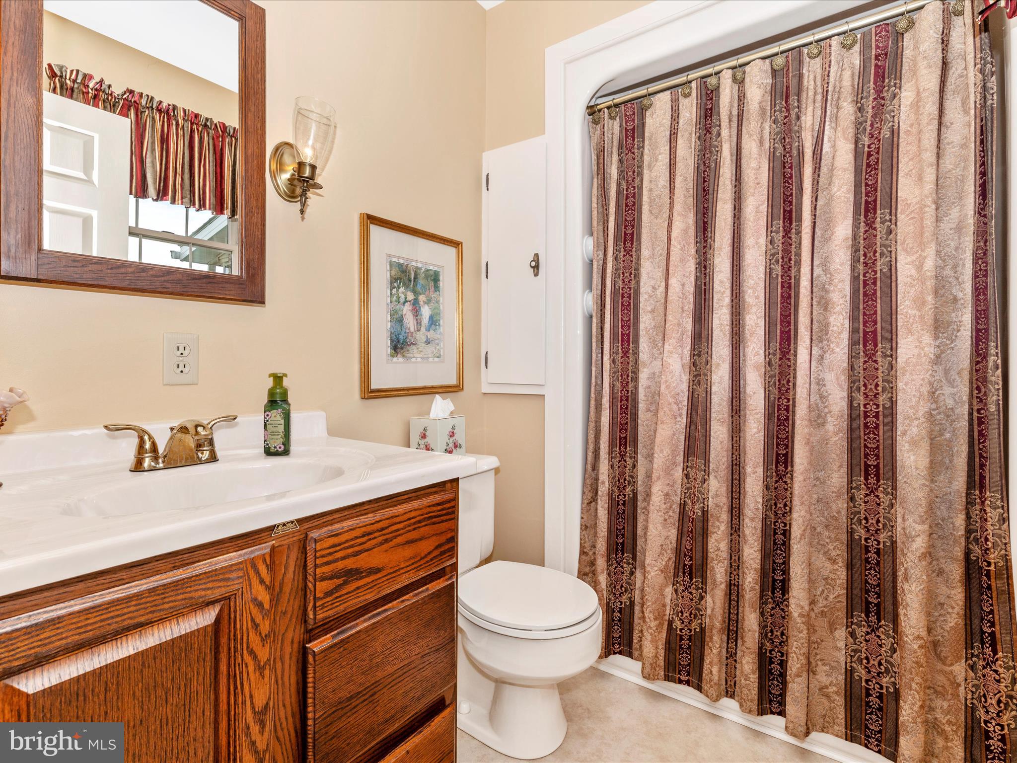12720 Spickler Road Clear Spring, MD 21722 - Photo 26 of 57 a bathroom with a granite countertop sink toilet and mirror