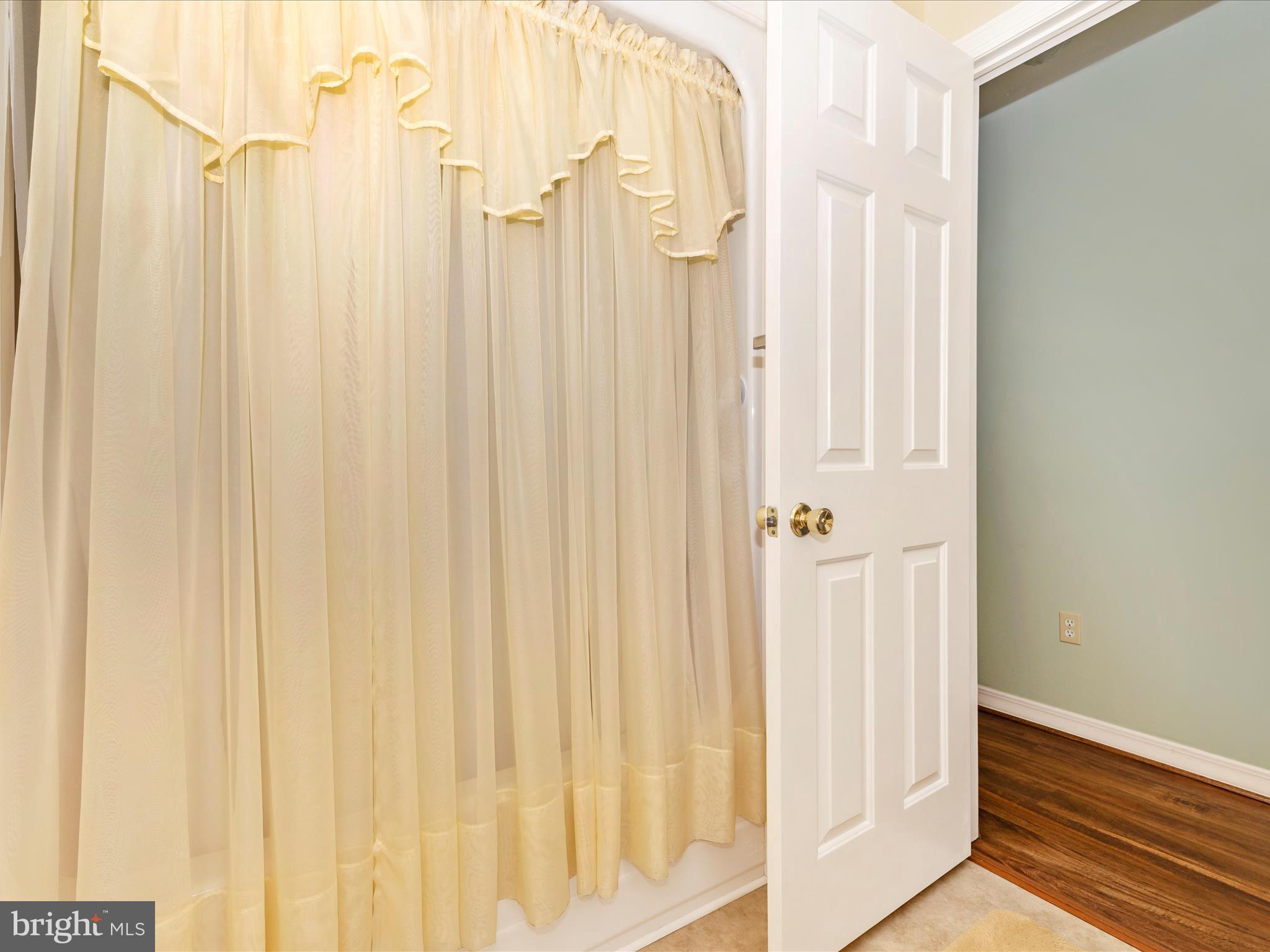 12720 Spickler Road Clear Spring, MD 21722 - Photo 32 of 57 a view of a bathroom with a shower curtain