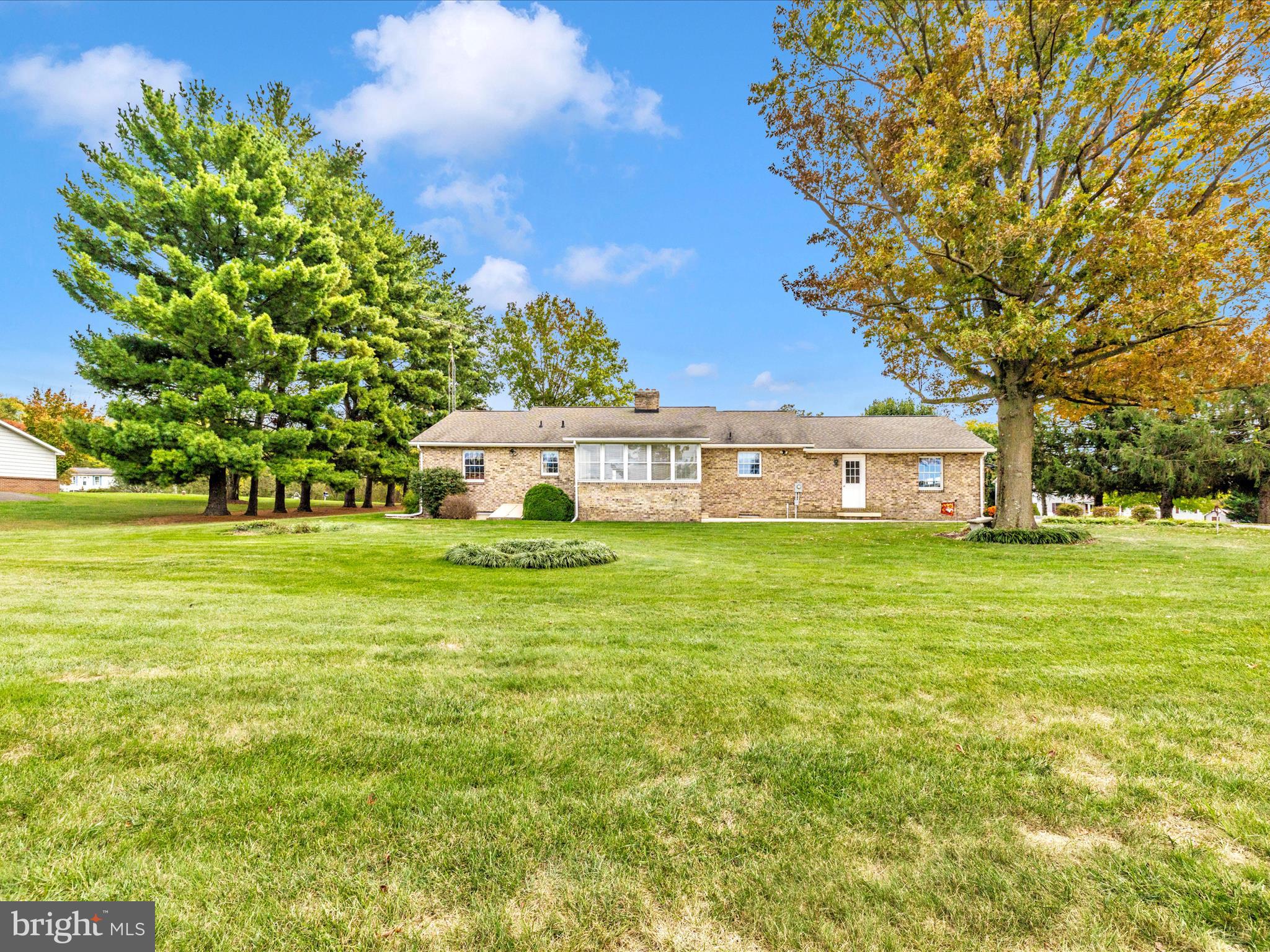 12720 Spickler Road Clear Spring, MD 21722 - Photo 52 of 57 a front view of a house with a garden