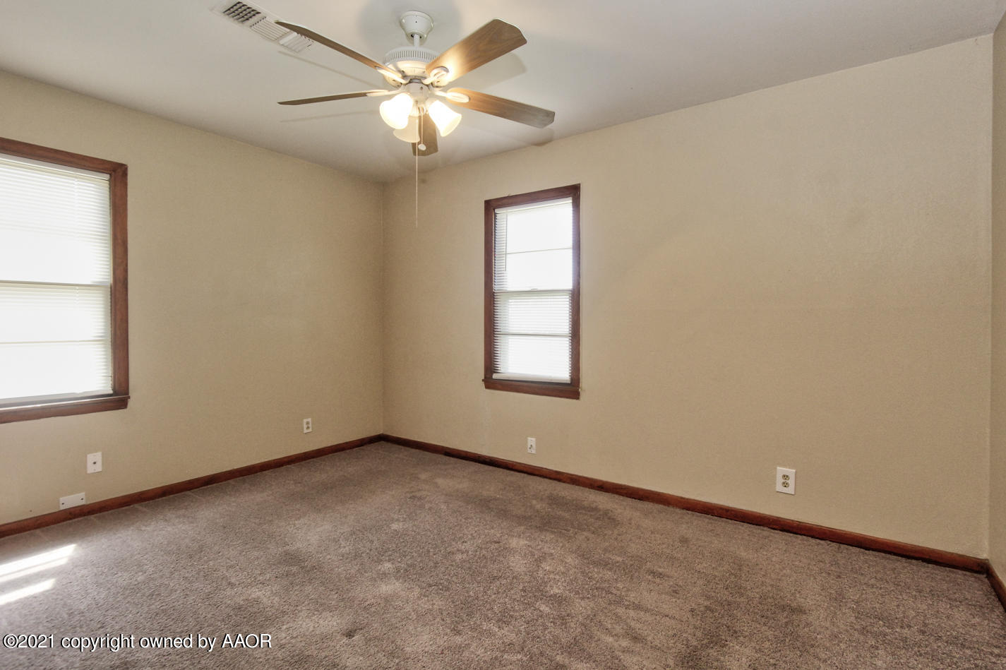 500 Southwest 45th Avenue Amarillo, TX 79110 - Photo 6 of 12 an empty room with windows and fan