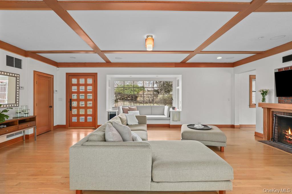 37 Hyatt Road Briarcliff Manor, NY 10510 - Photo 7 of 37 Living room with built-in window seat and paneled glass entry door