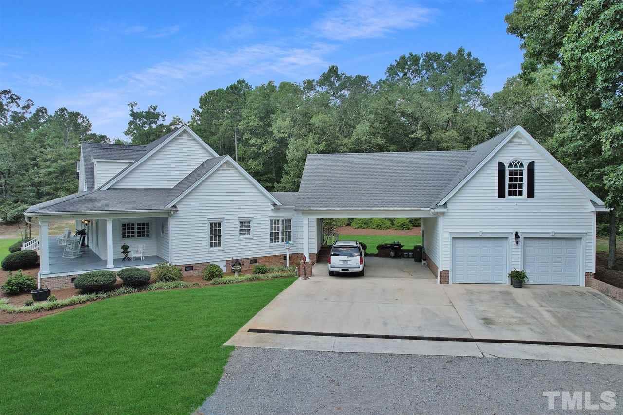 You will love the 2-car carport and 2-car garage with finished room over garage that has a half bath...love the side entrance to office if you need to work from home.
