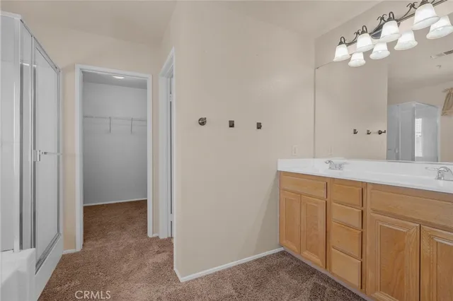 a bathroom with a sink vanity and a mirror