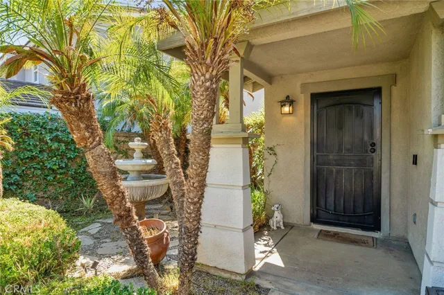 a pathway of a house with a yard