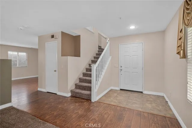 a view of an entryway with wooden floor