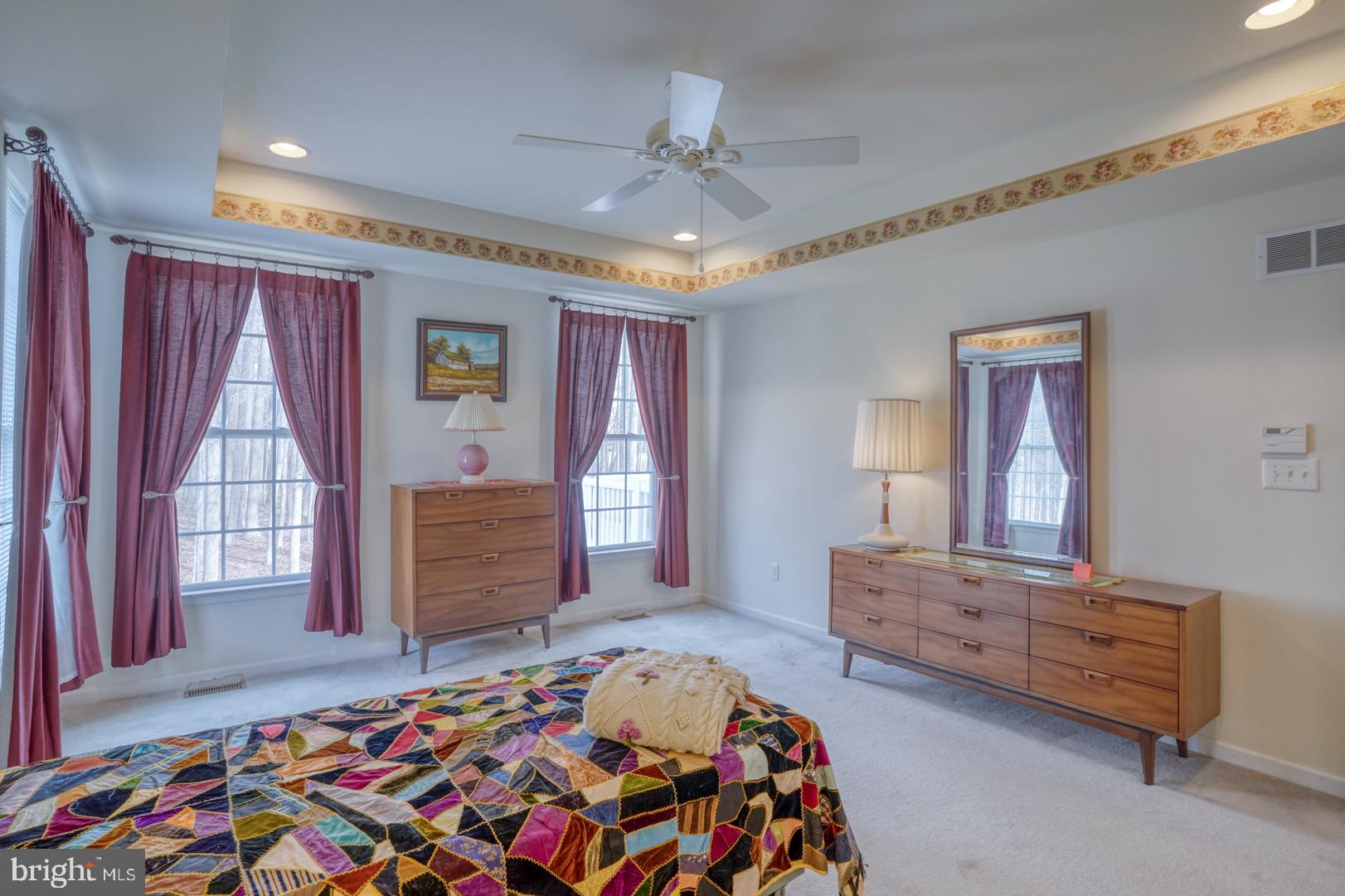 78 Springmill Drive Middletown, DE 19709 - Photo 21 of 60 a bedroom with a bed and a dresser in it