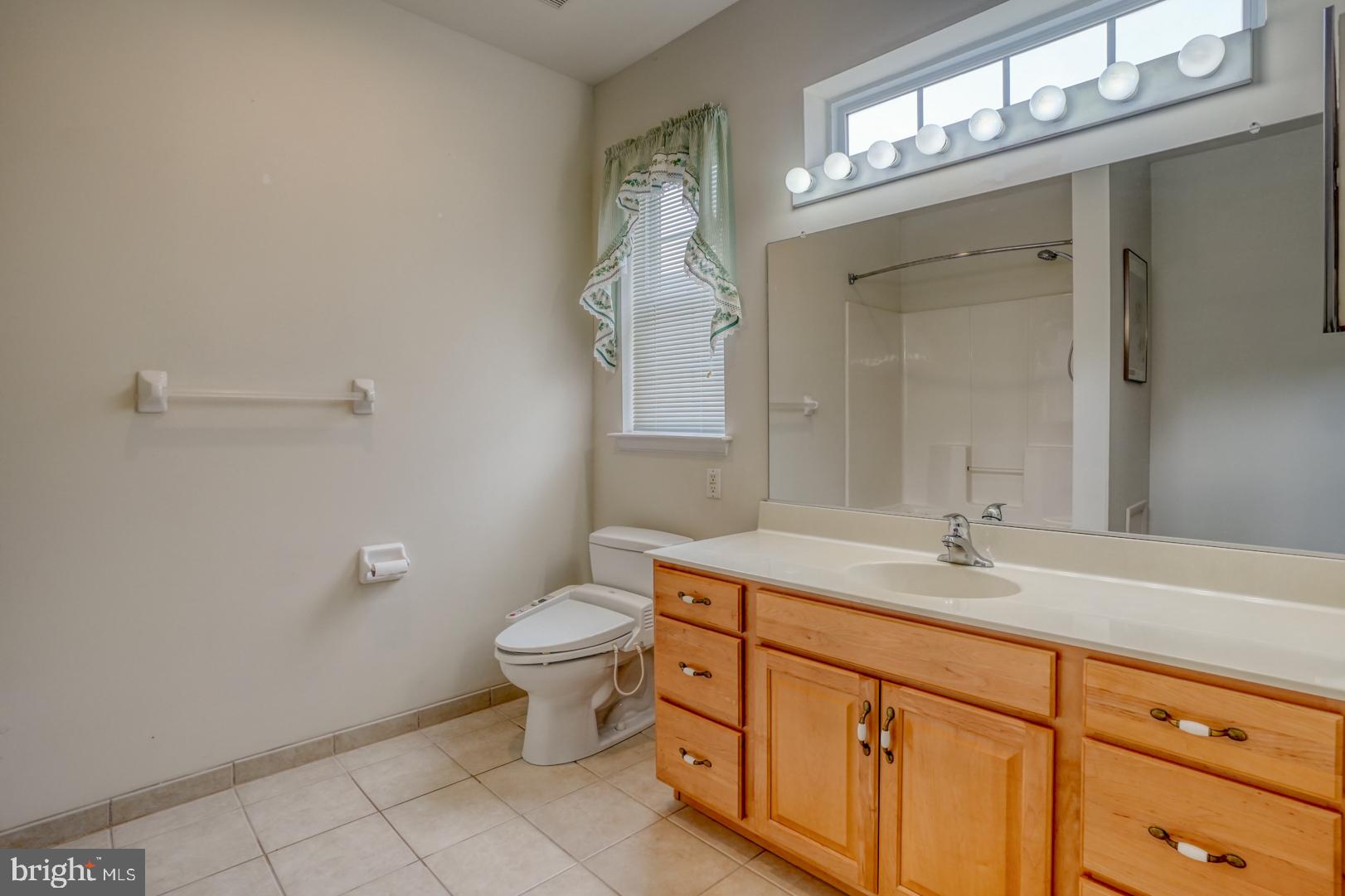 78 Springmill Drive Middletown, DE 19709 - Photo 23 of 60 a bathroom with a toilet sink and mirror